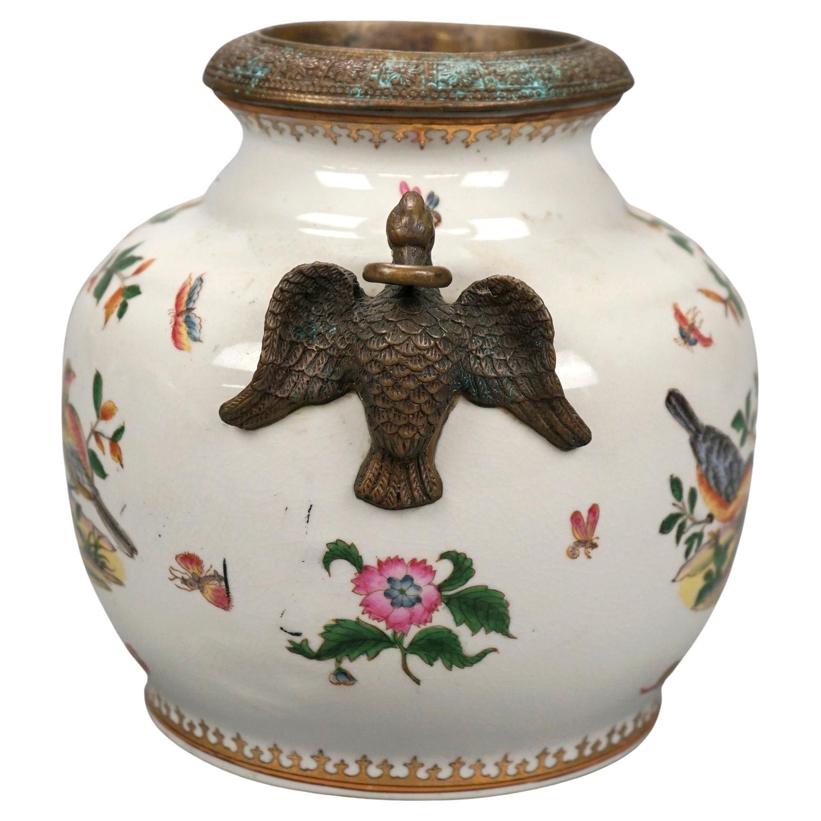 A pair of Chinese game pots offer porcelain construction with bird and foliate paint decoration and flanking figural bird handles, maker stamp on bases as photographed, 20th century

Measures- 8.5'' H x 8.25'' W x 9.5'' D.