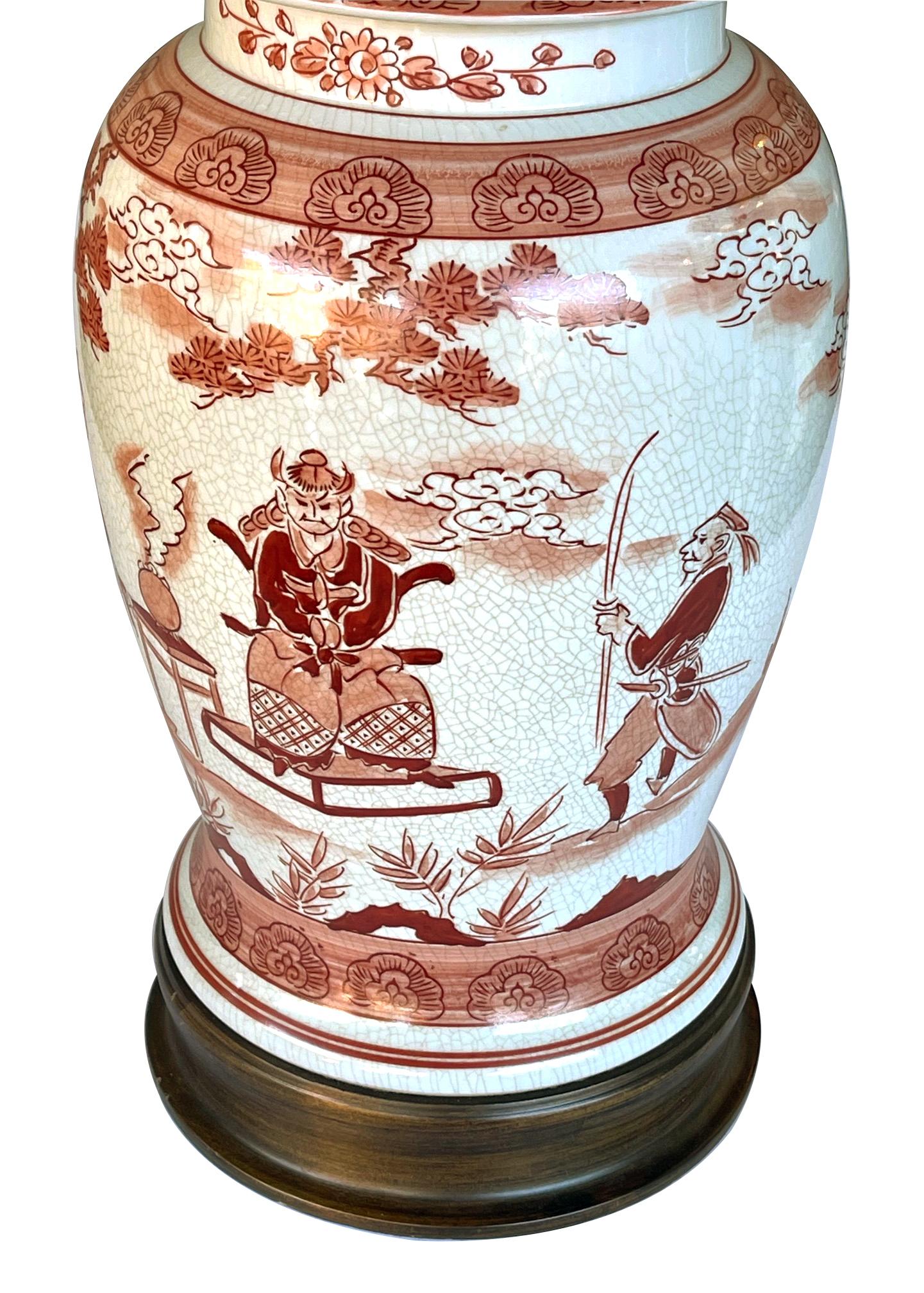 each hand painted ginger jar with domed lid above a bulbous tapering body raised on a stained wooden base; painted with various figures in a landscape setting divided by cloud scroll perimeter bands