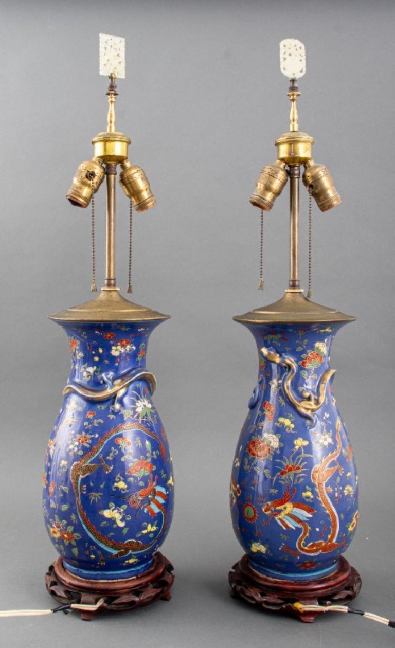 Pair Chinese Porcelain Dragon Vases Mounted as Lamps, 19th century, on carved wood base. Provenance: Property from a Park Avenue collection.

Dealer: S138XX