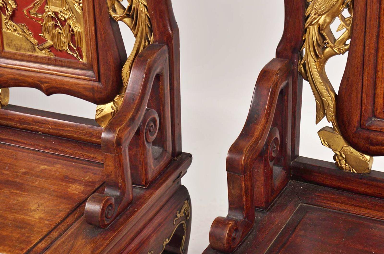 Pair Chinese Qing ceremonial chairs 19th century

Each with a profusely carved and parcel-gilt back above a panelled seat, 
raised on scroll legs to the fore, joined by stretcher rails.

Measures: 102 cm. high; 53 cm. wide; 44 cm. deep

Very