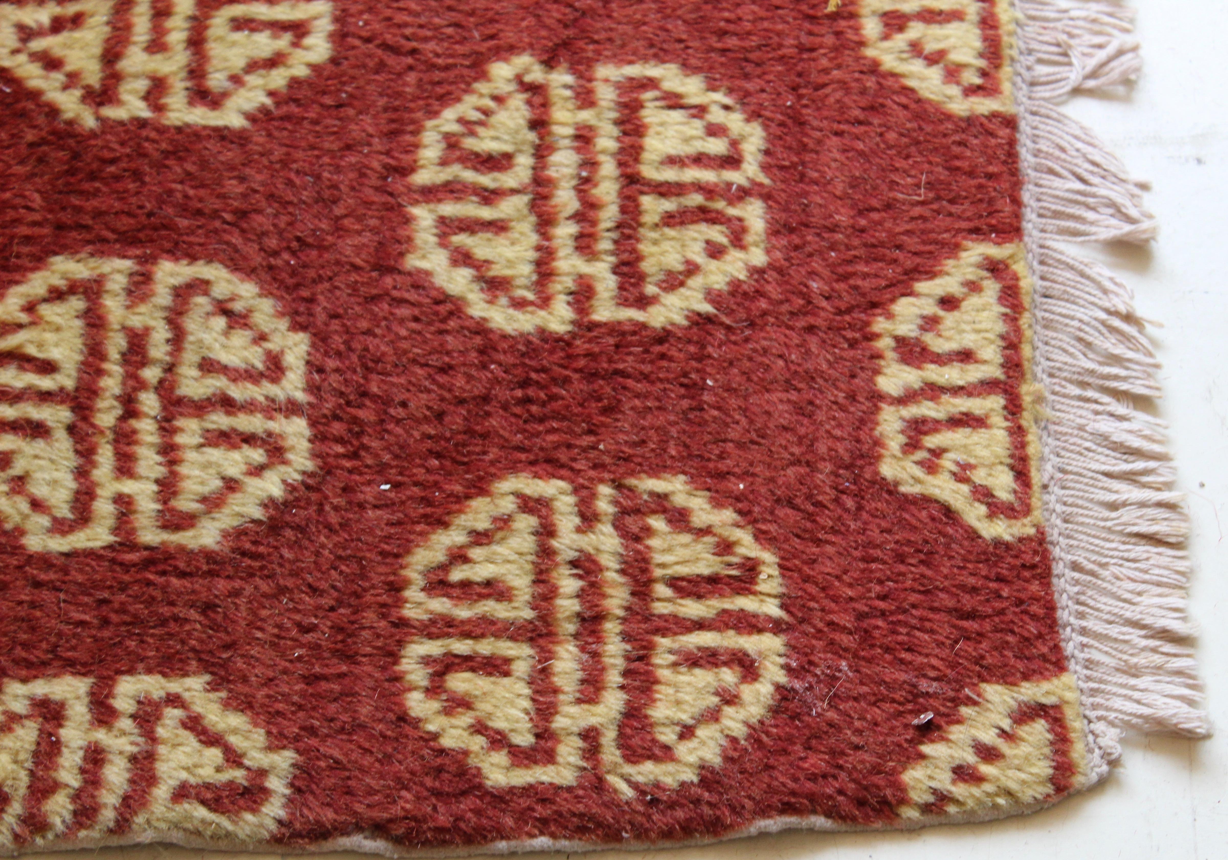 Striking pair of Chinese geometric rugs circa 1930 . The red ground decorated throughout with consistent geometric pattern, from the Gansu province.



  