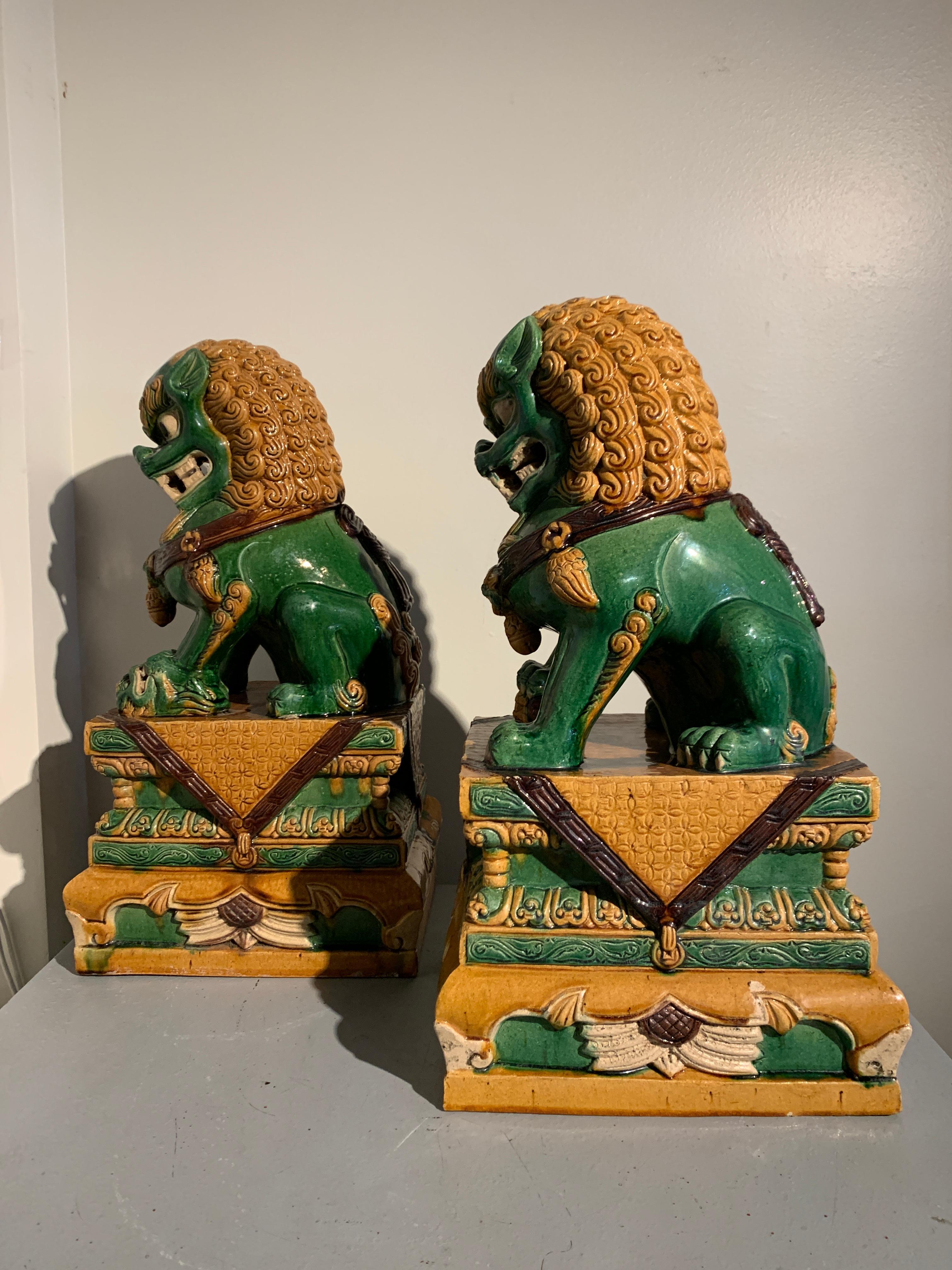 Pair Chinese Sancai Glazed Stoneware Guardian Foo Lions, 1960s, China In Good Condition In Austin, TX