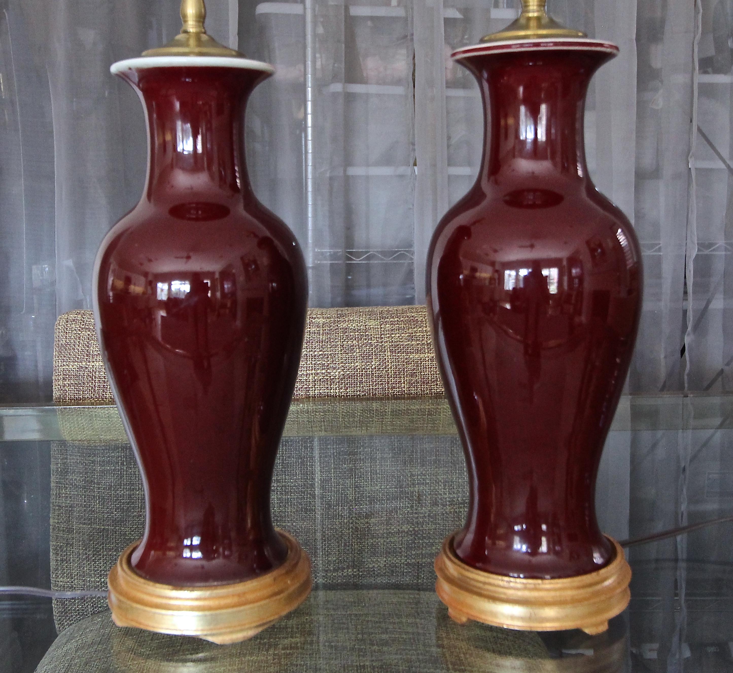 Mid-20th Century Pair of Chinese Sang De Boeuf Oxblood Glazed Porcelain Table Lamps