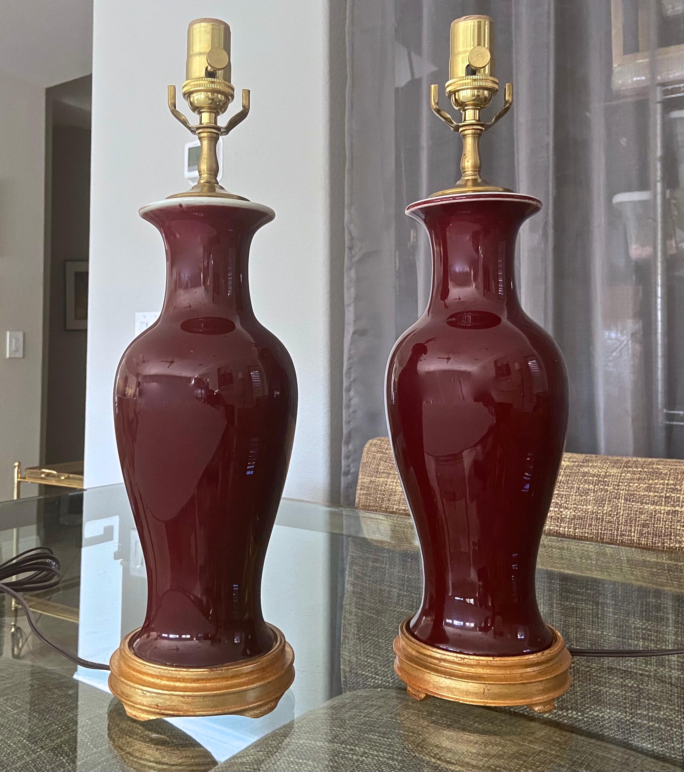 Brass Pair of Chinese Sang De Boeuf Oxblood Glazed Porcelain Table Lamps