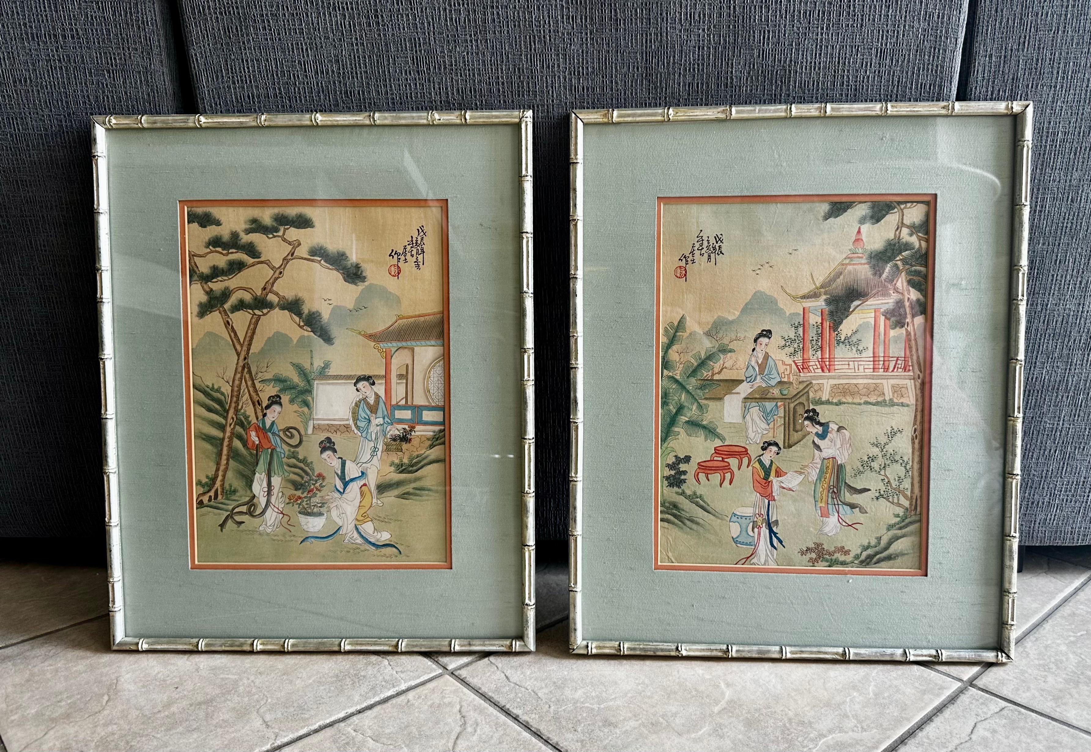 Pair early 20th century Chinese silk paintings depicting elegant ladies in robes in outdoor setting with trees, foliage and Chinese architecture. Beautifully mounted in silver giltwood faux bamboo frames and silk matting. Both with calligraphy