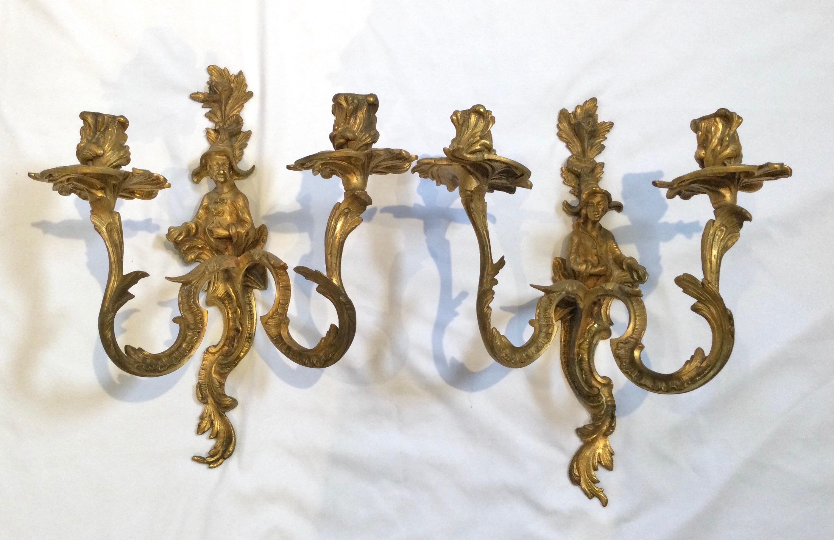 Pair of double candle light antique gilt bronze figural sconces. A fine pair 19th century figural French gilt bronze chinoiserie sconces in original condition with some tarnishing from age. Measures: 15
