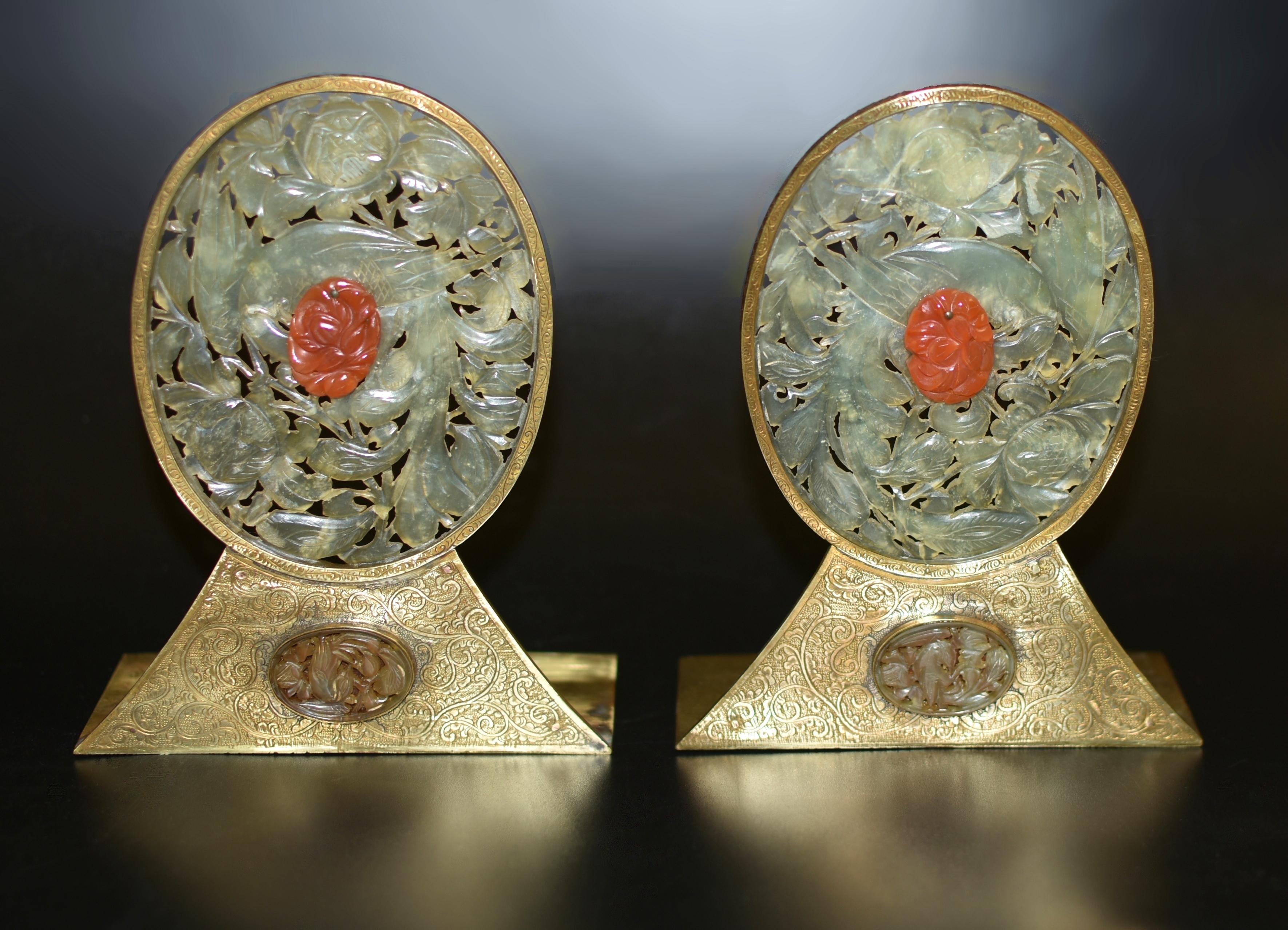 A rare, beautiful pair of antique Chinese bookends. Showcasing the beauty of translucent white jade with clarity almost to transparency, hand-carved depicting a graceful phoenix amid profusely blooming peonies, framed by delicately engraved solid
