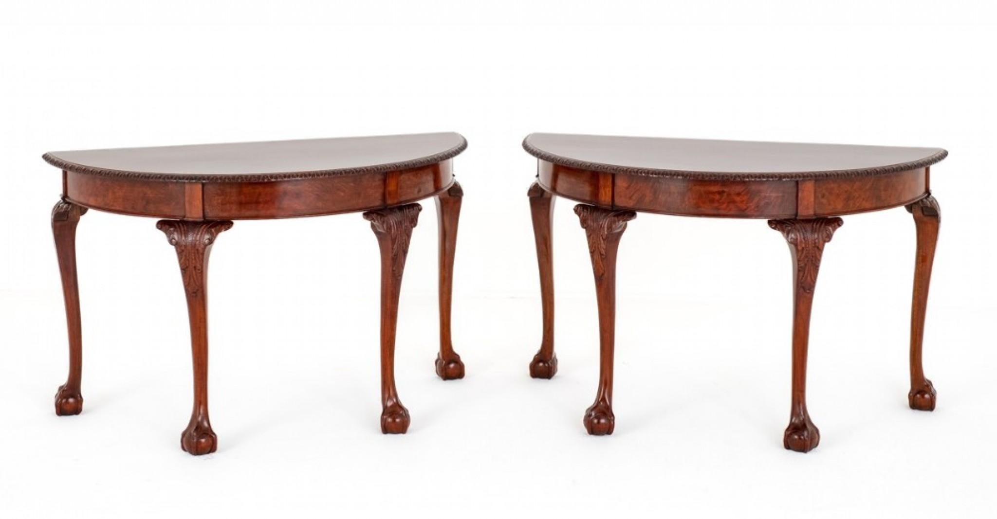 Pair of Mahogany Chippendale Style Console Tables.
These Console Tables are Raised Upon Cabriole Legs with Boldly Carved Ball and Claw Feet and Carved Decoration to the Knees.
The Demi Lune Shaped Tops also Having Carved Decoration.
Presented in