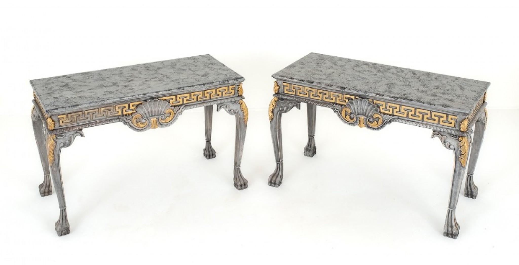 Pair of Chippendale Style Painted Console Tables.
These Impressive Tables Stand upon Shaped Legs with Hairy Paw Feet.
The Knees adorned with Carved Acanthus Leaves.
The Frieze of the Tables Having Greek Style Decoration.
The Fronts of the Tables