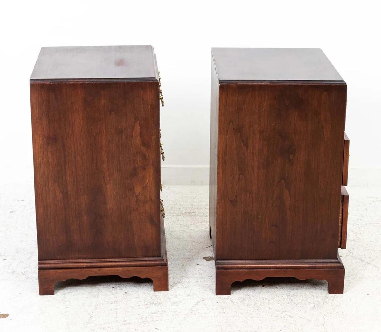 Pair of Chippendale Style End Tables with three drawers each with brass pulls. Quality construction throughout. Some wear to finish from age and use. 
