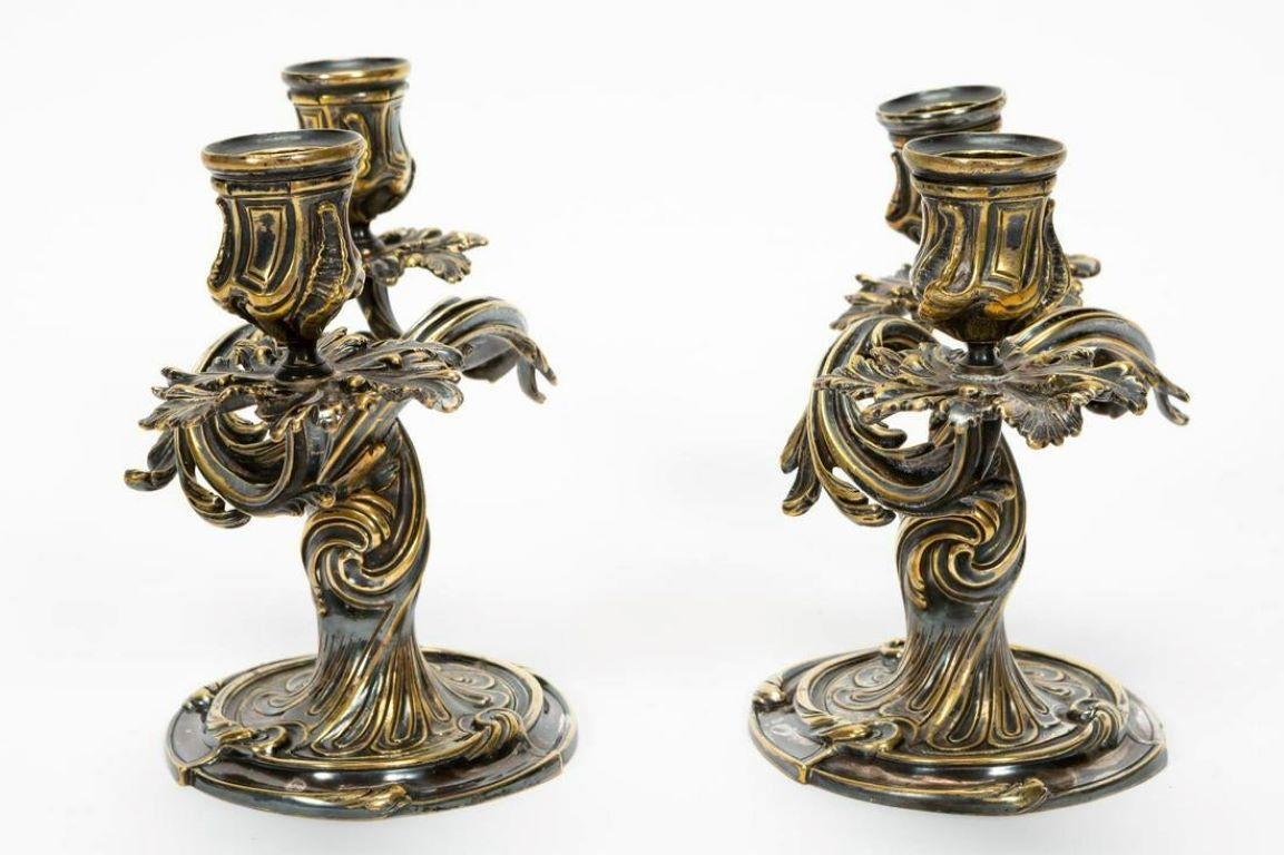 Christofle (French, founded 1830), late 19th century. A pair of Louis XV Rococo style silver plate two light candelabra having foliate twisting form raised on circular foot. Marked to underside.
Approx. H 7