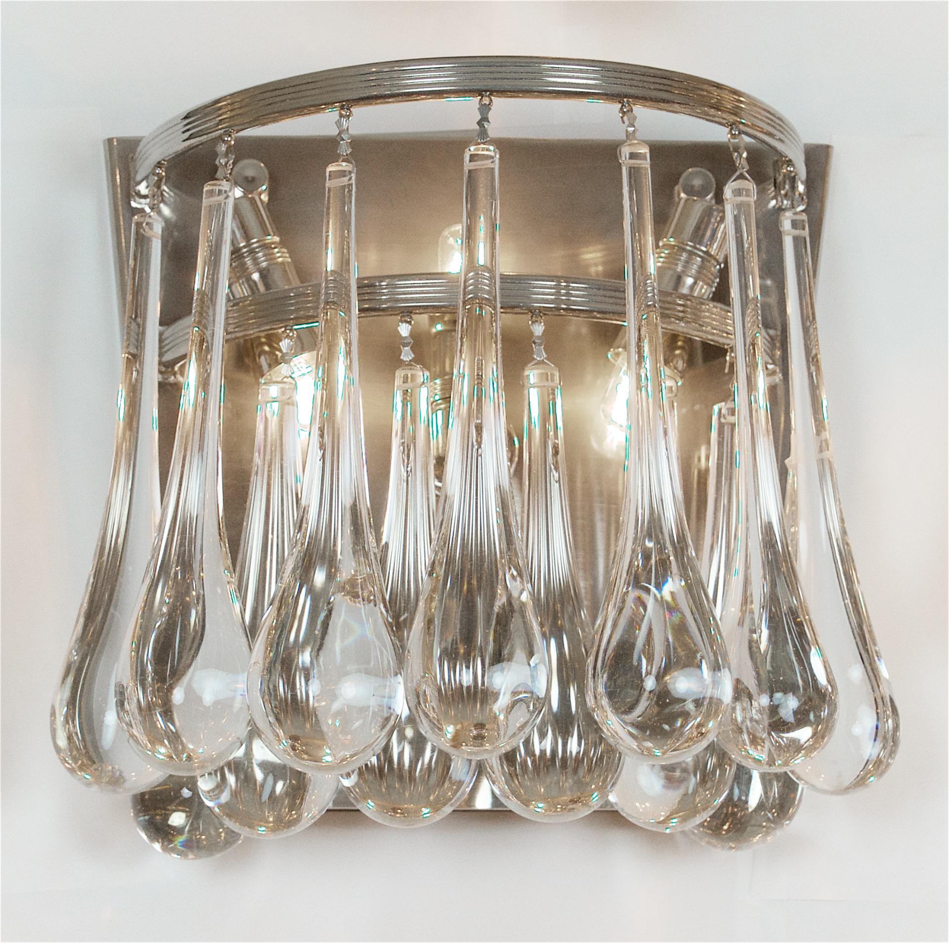 Elegant sconces by Cristoph Palme with substantial, heavy crystal teardrops. Sconces can be hung in either format shown.

Takes three E-14 base bulbs per sconce up to 40 watts per bulb, new wiring.

Price listed is per pair.
