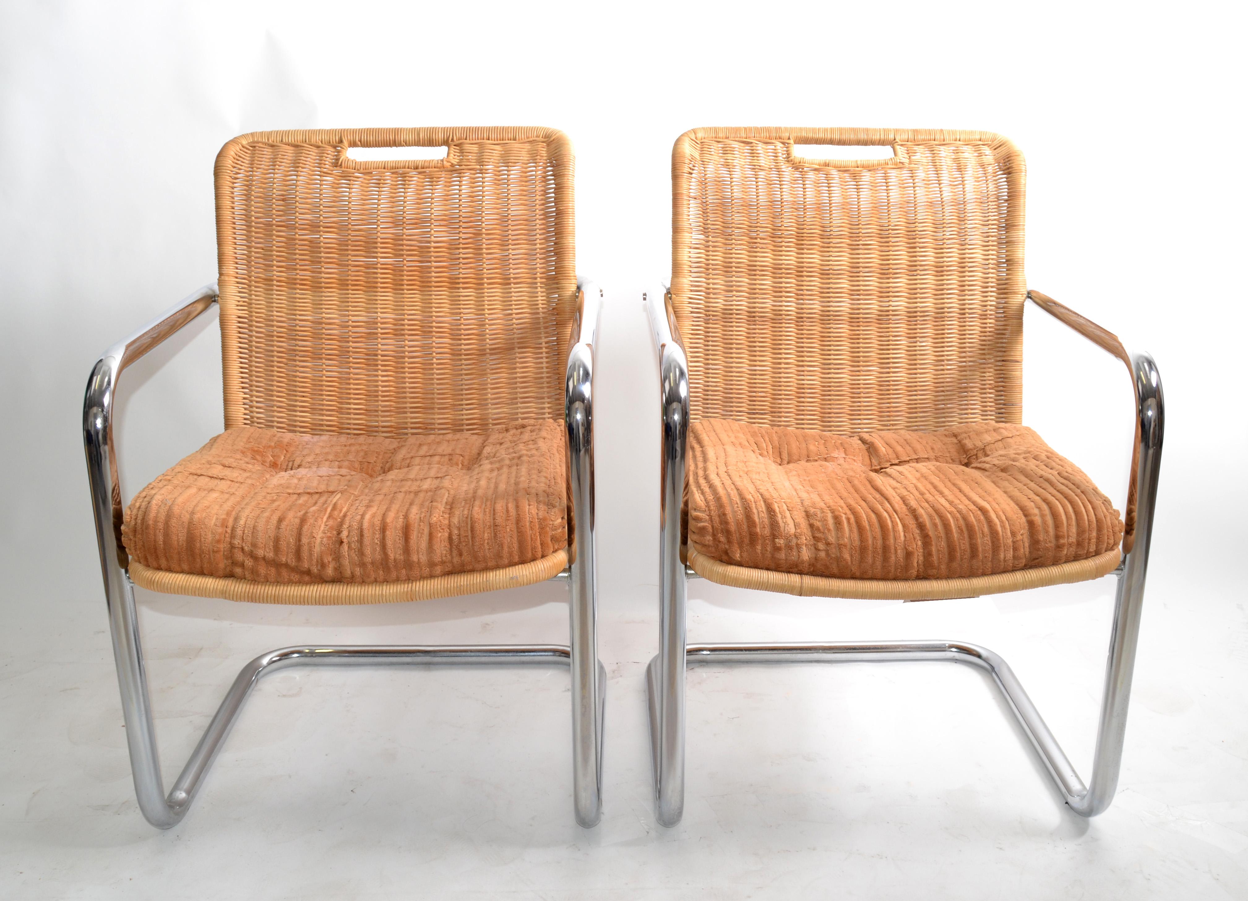Pair of Harvey Probber attributed armchairs or dining room chairs in brown seat upholstery and wicker backrest.
Solid chrome tubular frames with cantilever swing, very comfortable.
Both chairs have original paper tag under the seat.
Arm height: 24.5