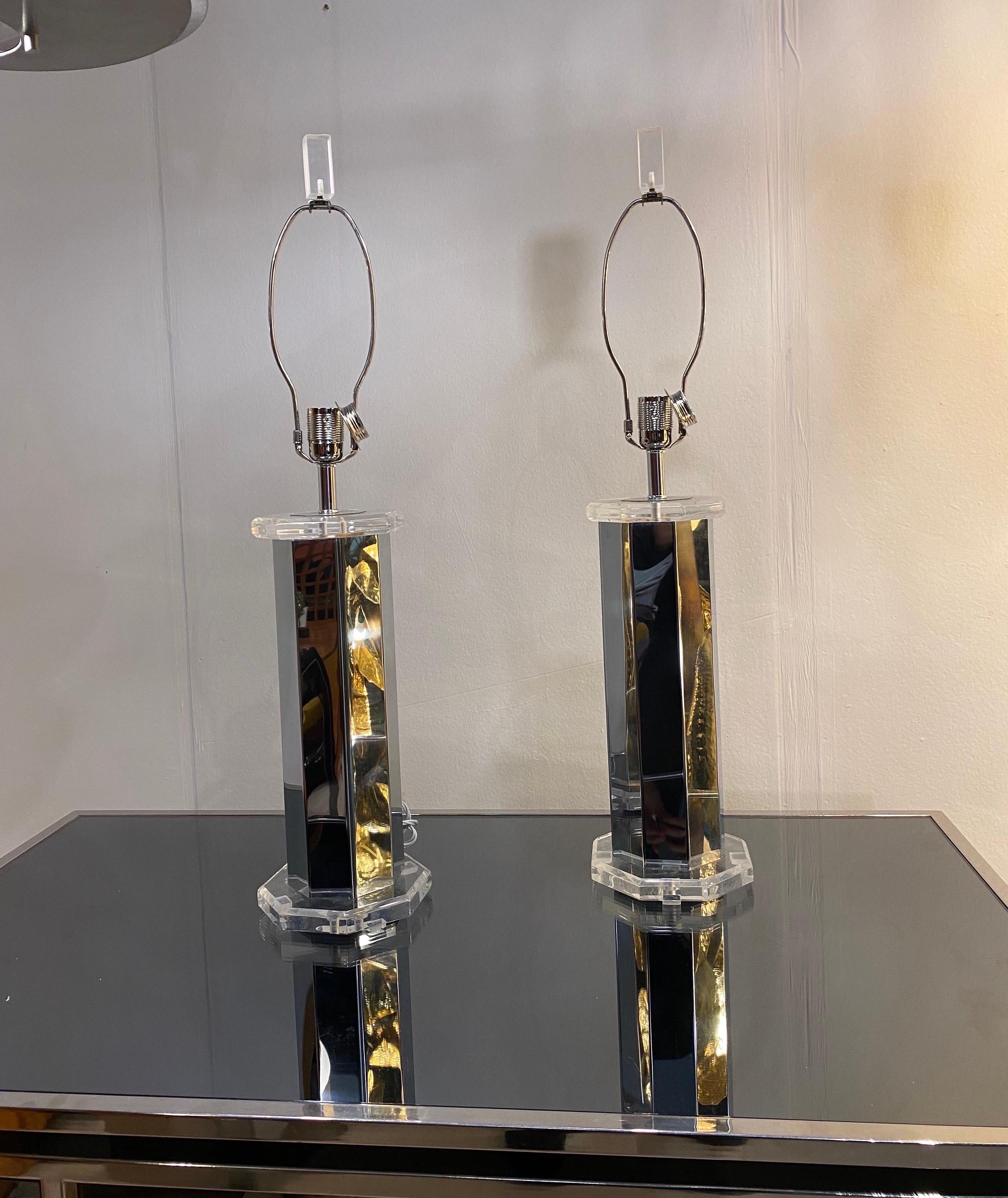 An impressive and elegant tall pair of octagonal steel chromium table lams with lucite details.

This minimal pair of table lamps with a mirror polish surfaces is giving that wow effect and with the right lampshades they would look amazing in any