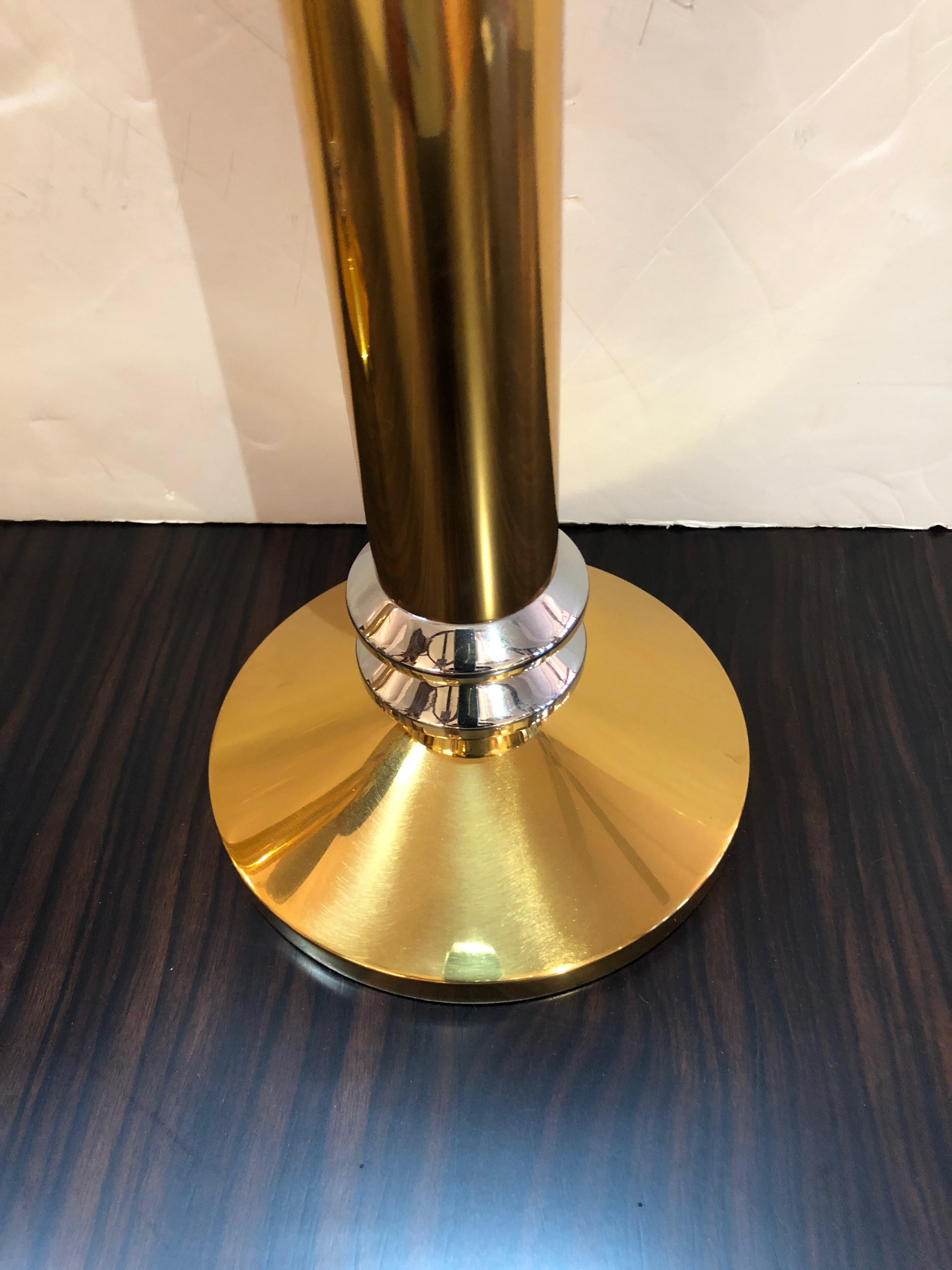 Two impressively large and heavy candlesticks, one slightly taller than the other, having a stunning mix of metals, primarily brass with chrome details.
Smaller measures 15 inches
Taller is 18