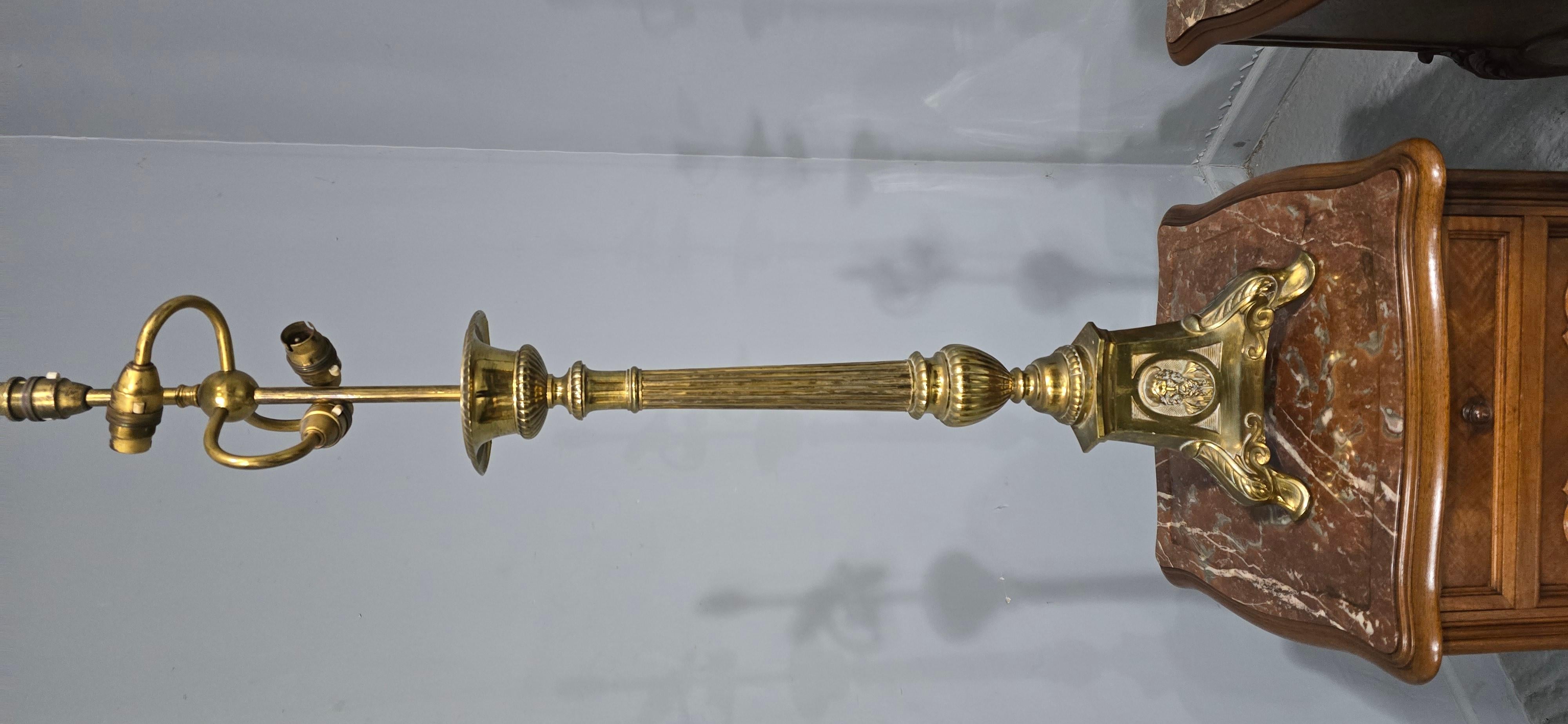 A very nice pair of brass double bulb church candlestick table lamps.

40