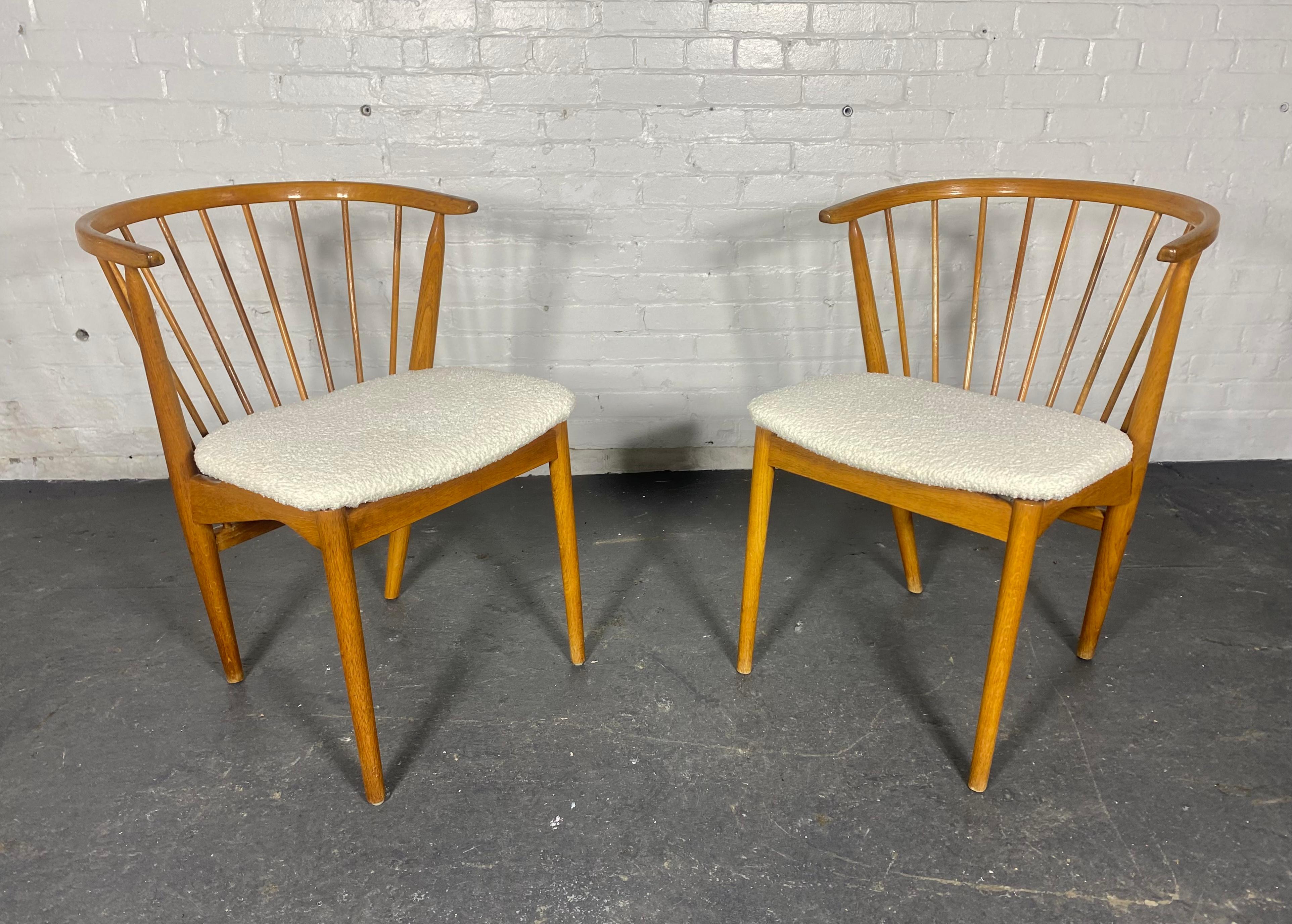 Pair cLASSIC Danish Spindle Barrel Back Arm Chairs by George Tanier 
 for Sibast , Made in Denmark...Retains original finish to wood frame, reupholstered in a white wool boucle.