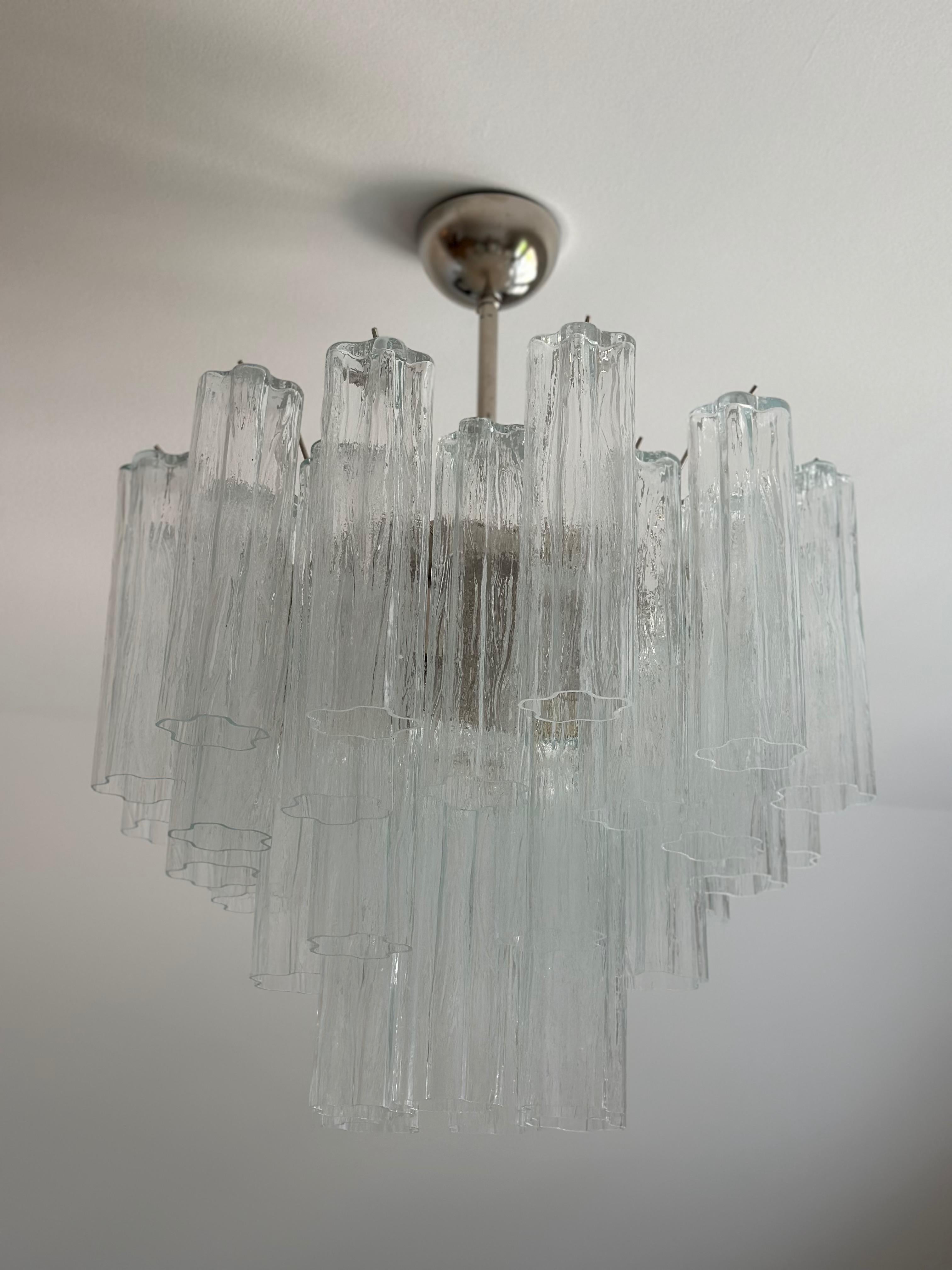 Set of two 2 Classic Elegant Murano Chandeliers. Tubular Tronchi Formed Glass Prisms in Traditional Italian Mid-Century Style.
The murano fixture is composed of 36 Glass Elements in the size of 25 x7 cm (9.9