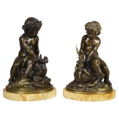 Pair Classical 19th Bronze Putti Seated on a Rock