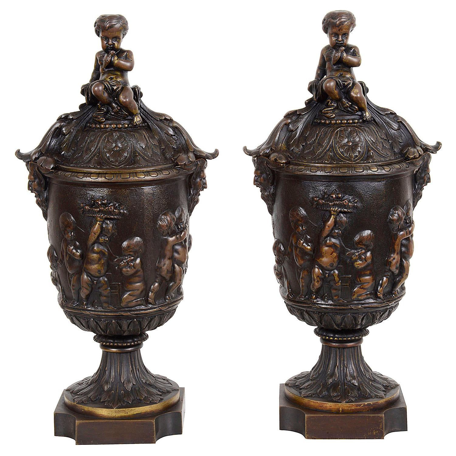 Pair of Classical 19th Century Bacchus Lidded Bronze Urns For Sale