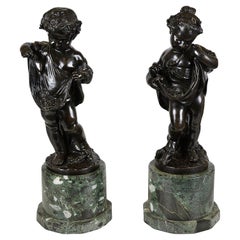 Pair classical bronze statues of children gathering grapes, 19th Century.
