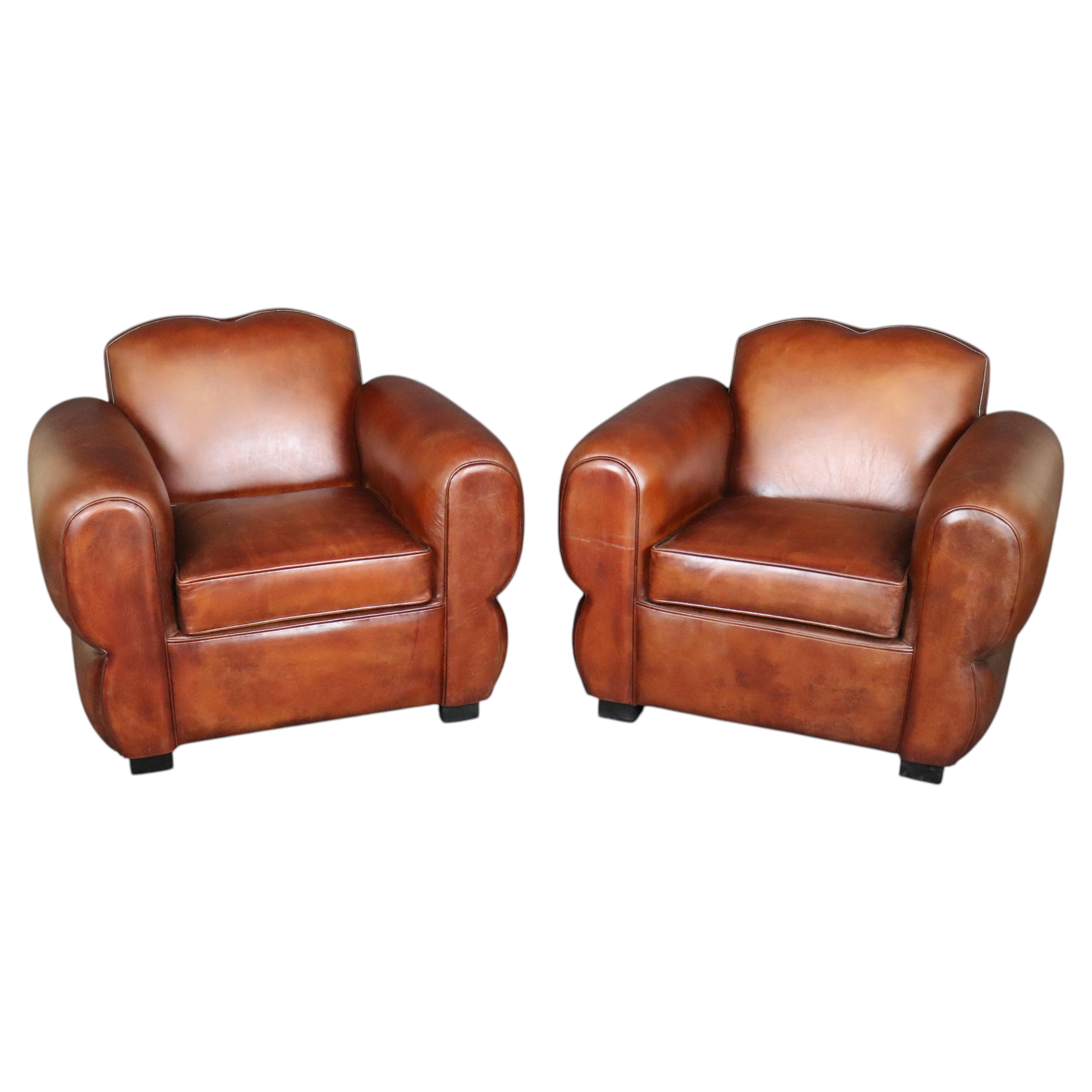 Pair Cognac Hued French Art Deco Style Leather Moustache Club Chairs