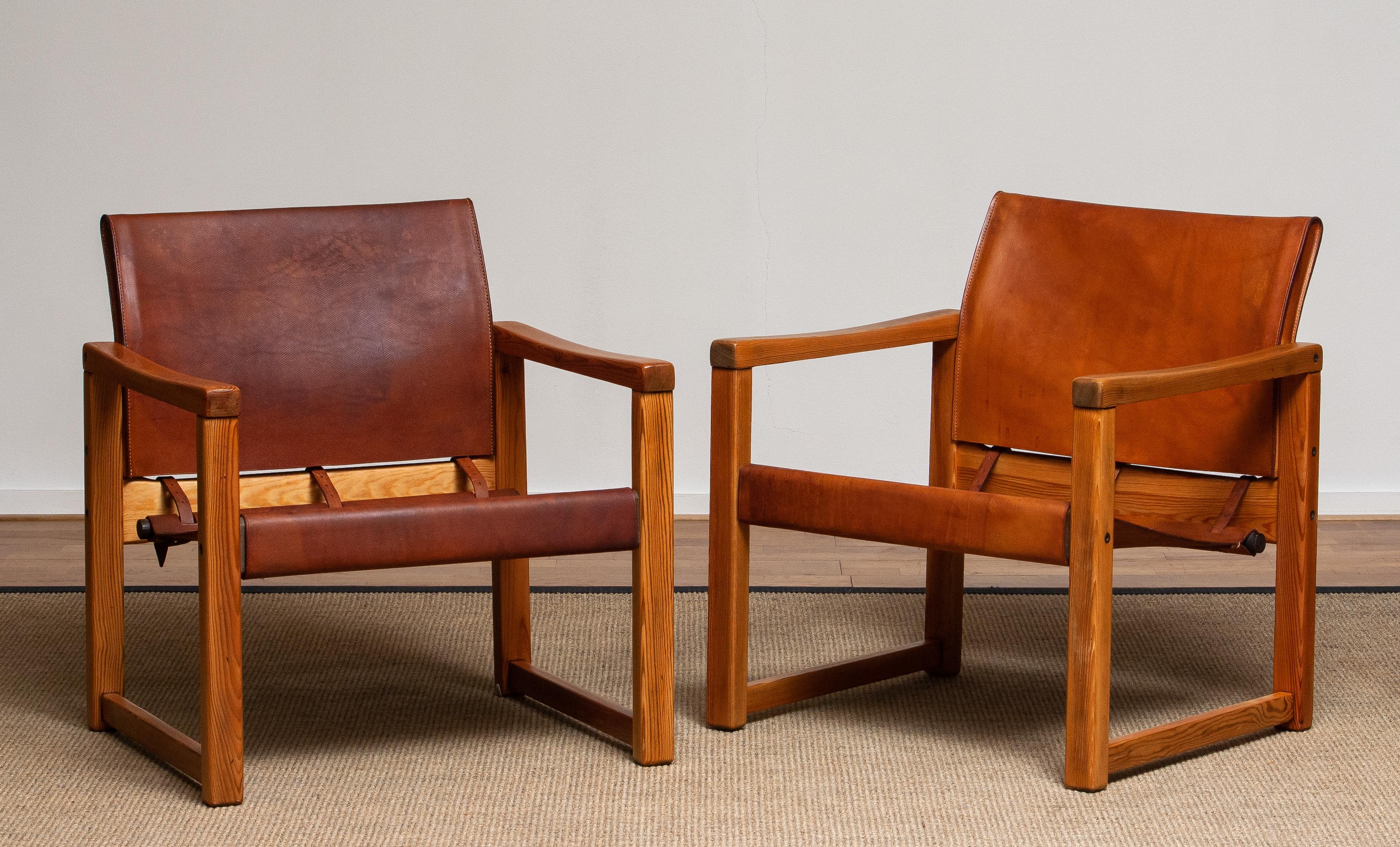 Beautiful set of two study cognac leather safari chairs (Model Diana) designed by Karin Mobring for Ikea Sweden. The model is lounged in 1974.
The leather on both chairs is in good and smooth condition and also has a beautiful patina true the