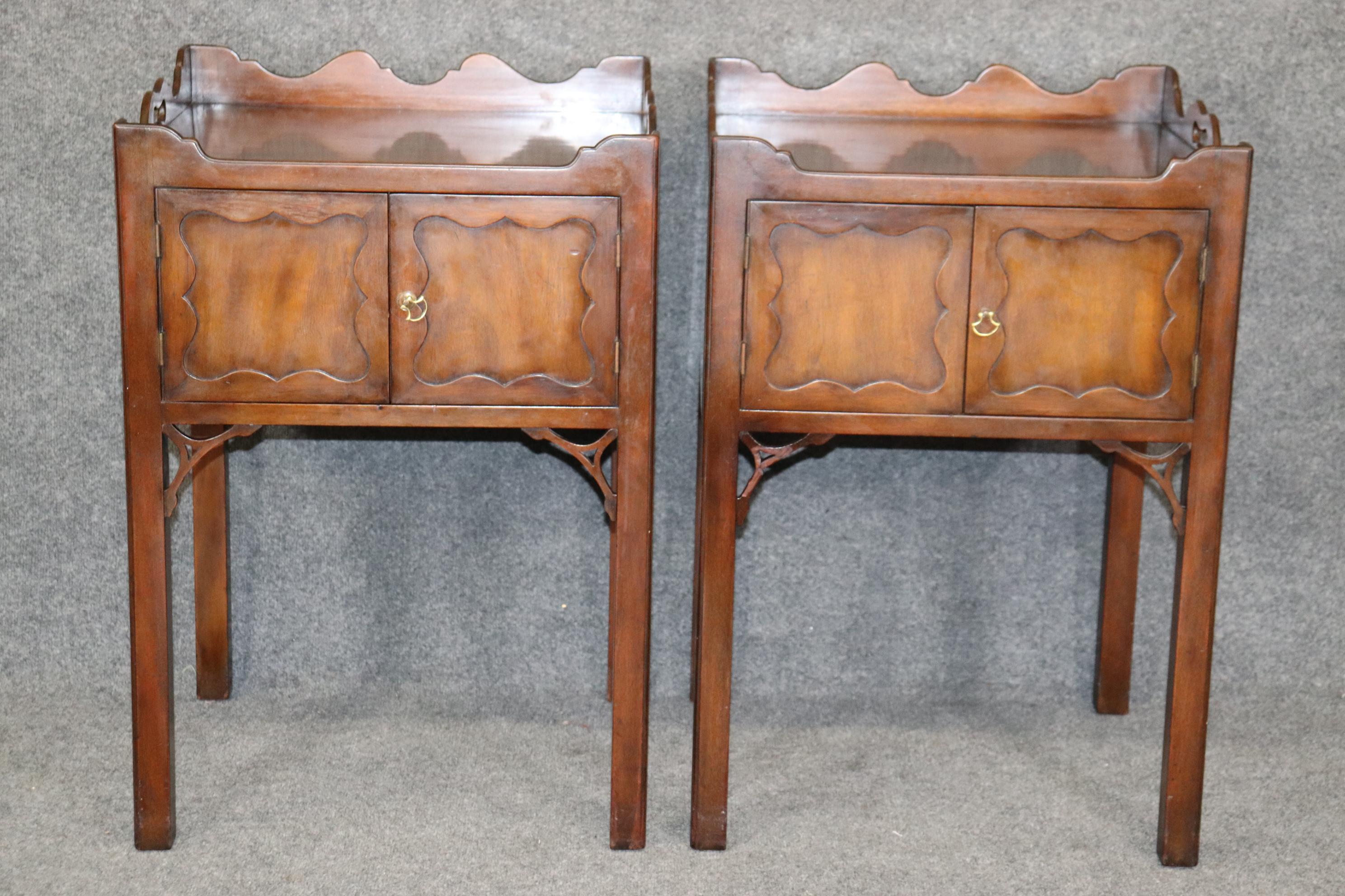 This is a gorgeous pair of Kittinger of Buffalo, New York CW collection nightstands or end tables. The tables are in good original condition and have their original finish and a nice patina. The stands are from a legendary company known for making