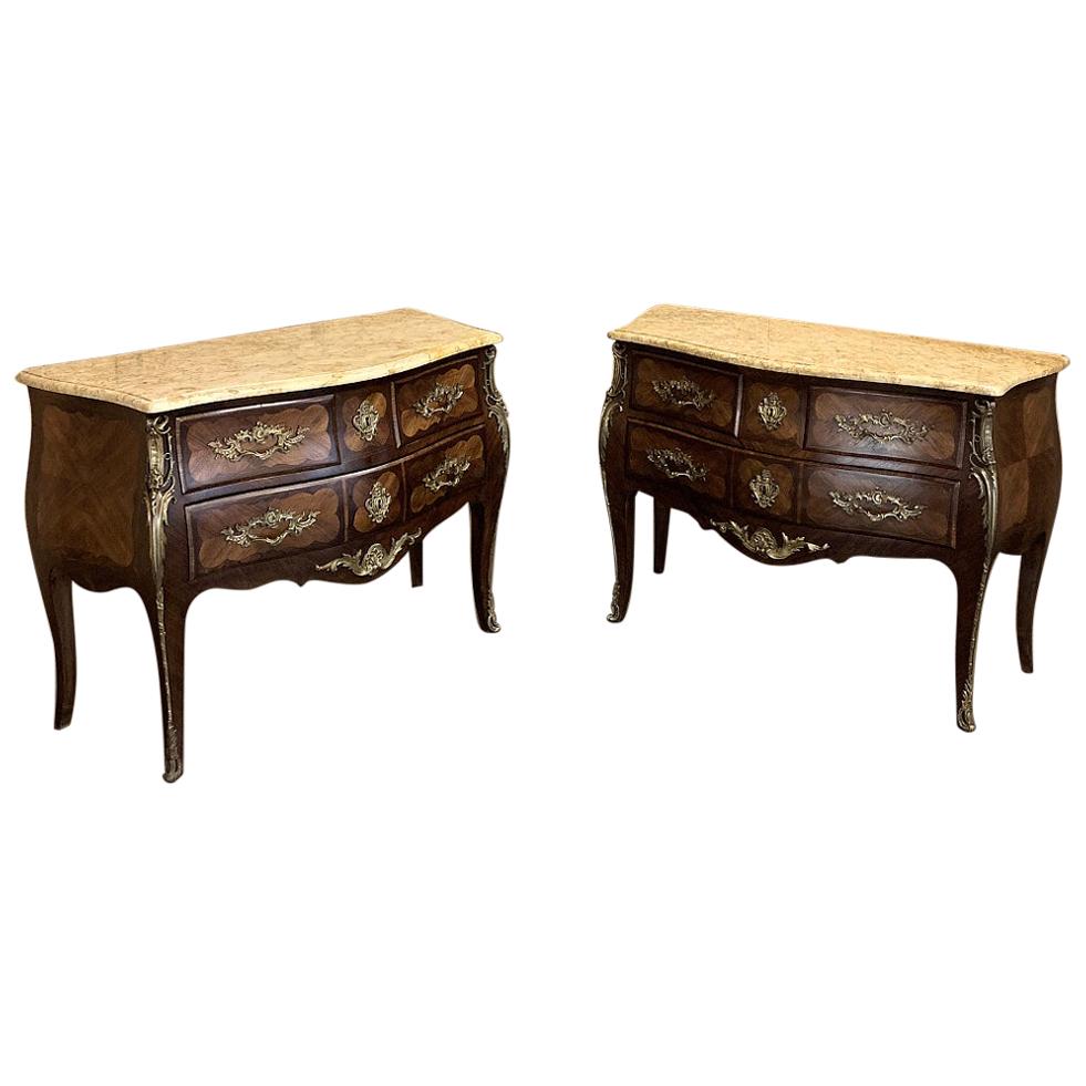 Pair of 19th century French marble-top marquetry bombe commodes is a truly spectacular and rare find! Master craftsmen created the undulating naturalistic form of the casework, with talented ebenistes adorning the facade with artistic inlay or