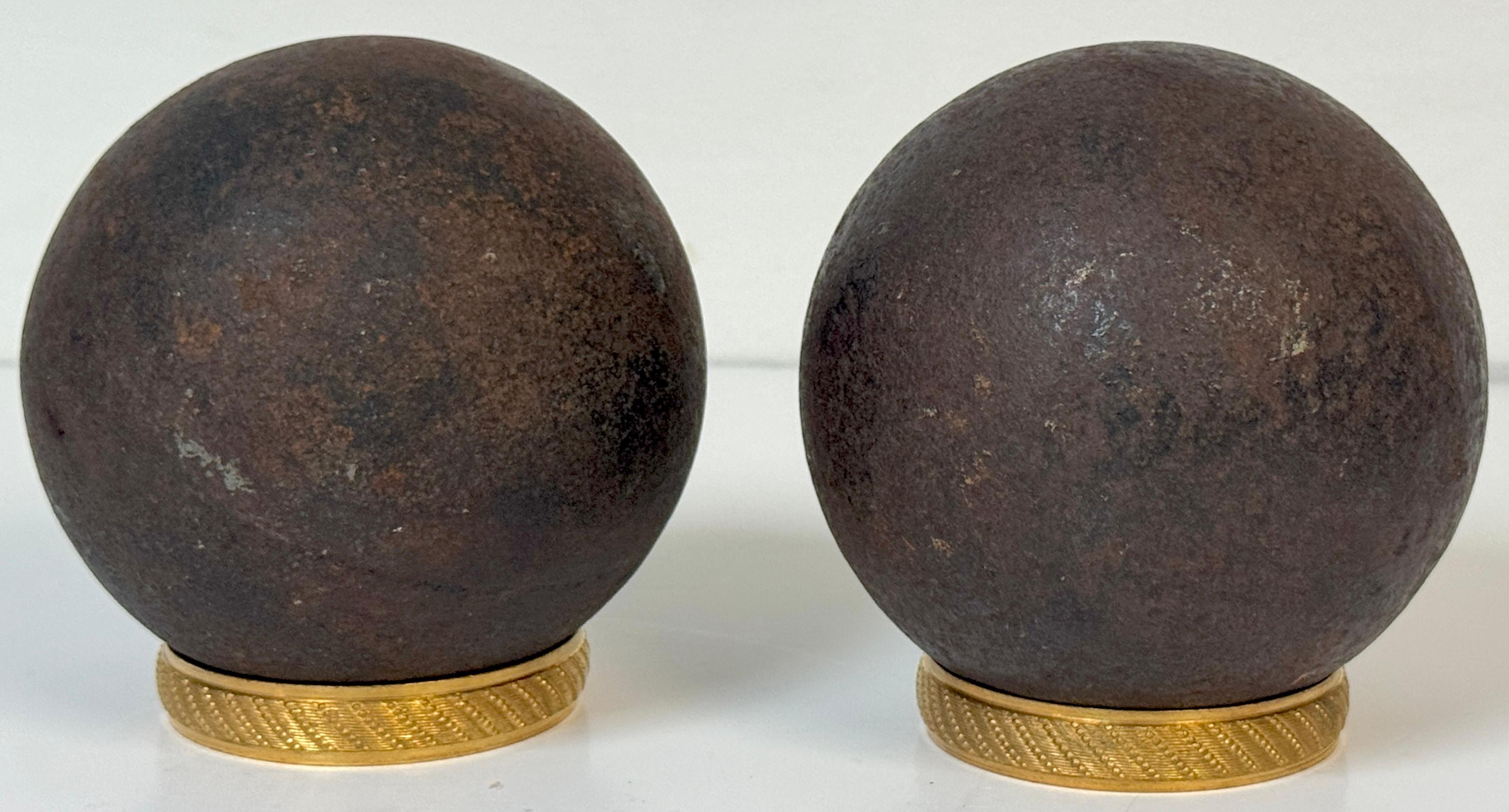 Pair of Confederate Civil War Cast Iron Cannonballs with Century Ormolu Mounts,* United States, Circa 1861–1863

*This offering consists of four pieces, two cannonballs, and two period ormolu display rings.

An evocative pair of solid cast iron