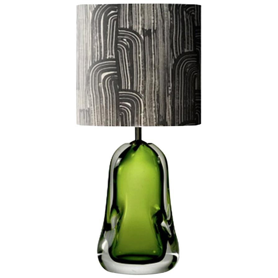 This engaging and contemporary pair of green blown glass table lamps are two high craftemenship pieces and they were made in United Kingdom.
These table lamps can be considered as objects of art for the solid presence of the Venetian  handcrafted