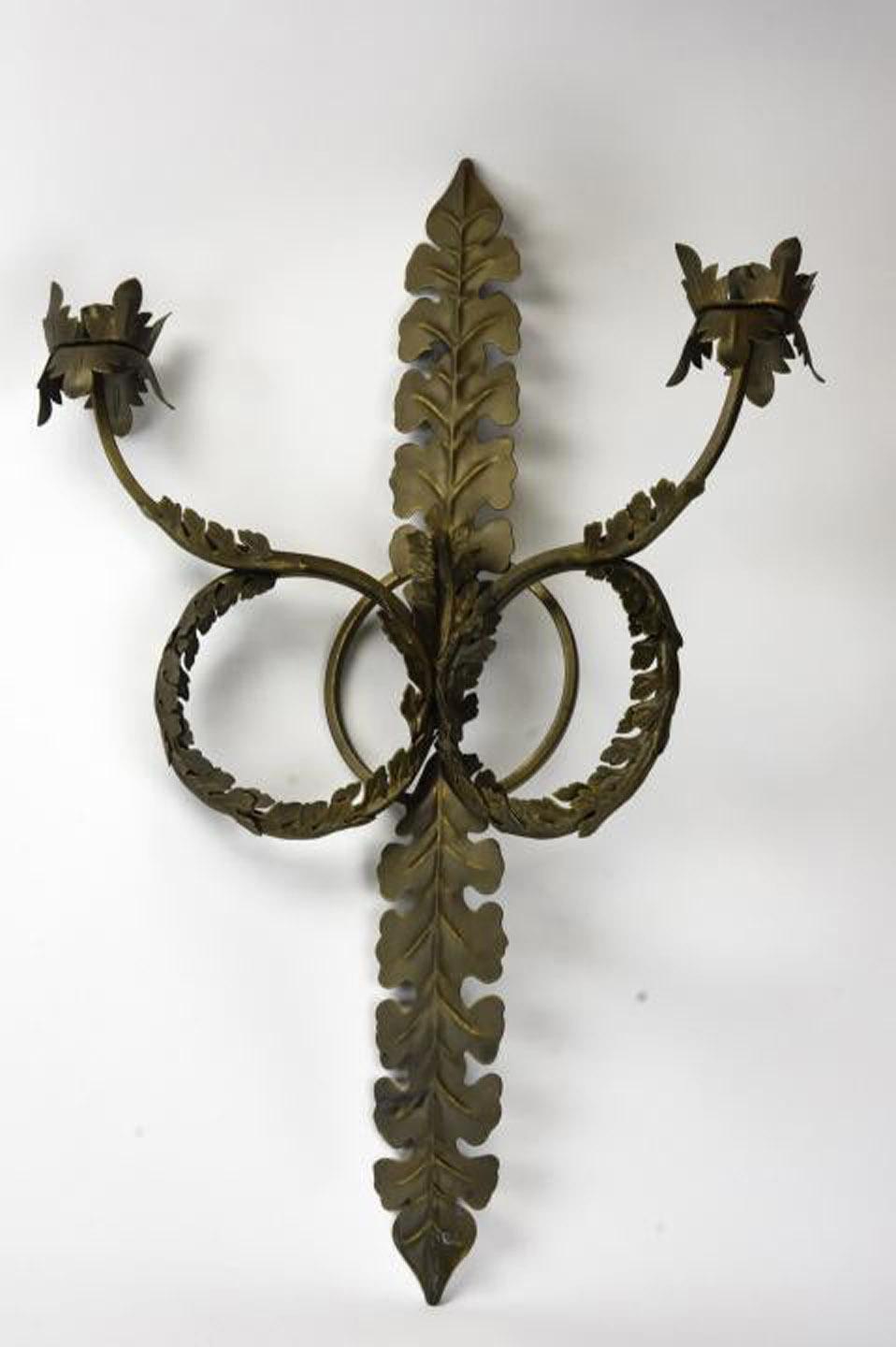 Pair of contemporary neoclassical style wall candle sconces in bronze tone, scroll and acanthus motifs.