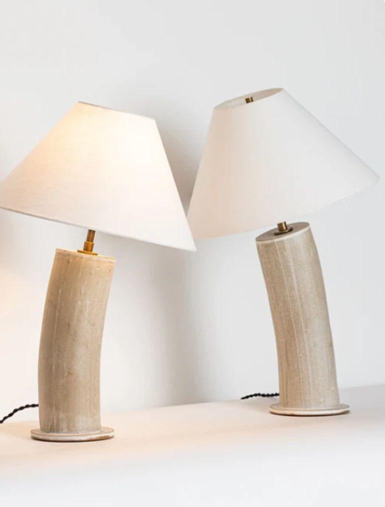Contemporary Stoneware Beige Glazed Ceramic Table or Desk Lamps, Parchment Glaze

Pair of stoneware lamps each having a parchment dipped glaze. The lamps are fitted with antique brass fittings with full-range dimmer sockers. Also equipped with a