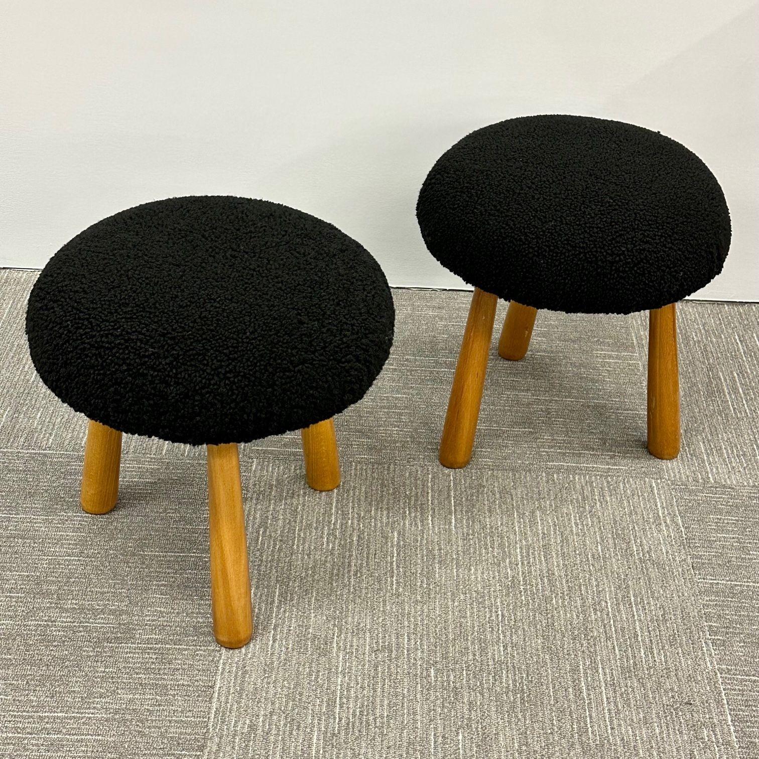 Pair Contemporary Swedish Modern Style Sheepskin Foot-Stools / Ottomans
 
Contemporary organic form tri-pod stools or ottomans. New comfortable foam cushioning and black dyed genuine shearling. Overall form and design inspired by Nordic design /