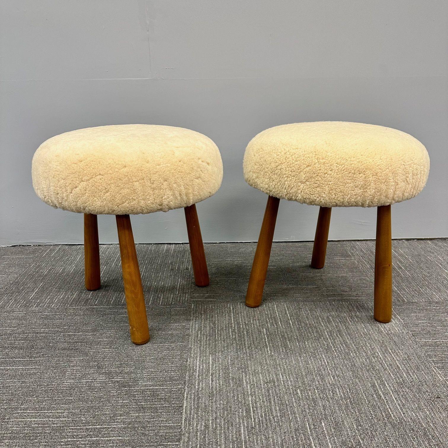 Pair Contemporary Swedish Modern Style Sheepskin Footstools / Ottomans, Beige
Contemporary organic form tri-pod stools or ottomans. New comfortable foam cushioning and black dyed genuine shearling. Overall form and design inspired by Nordic design /