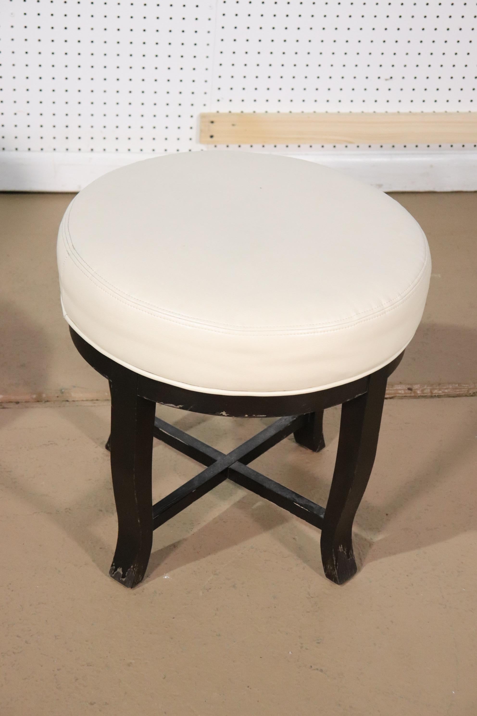 This is a nice pair of stools that can be gilded, painted or left as they are. They have a contemporary design and nice white leather seating surfaces. The stools measure 20 x 20 x 20 tall.
