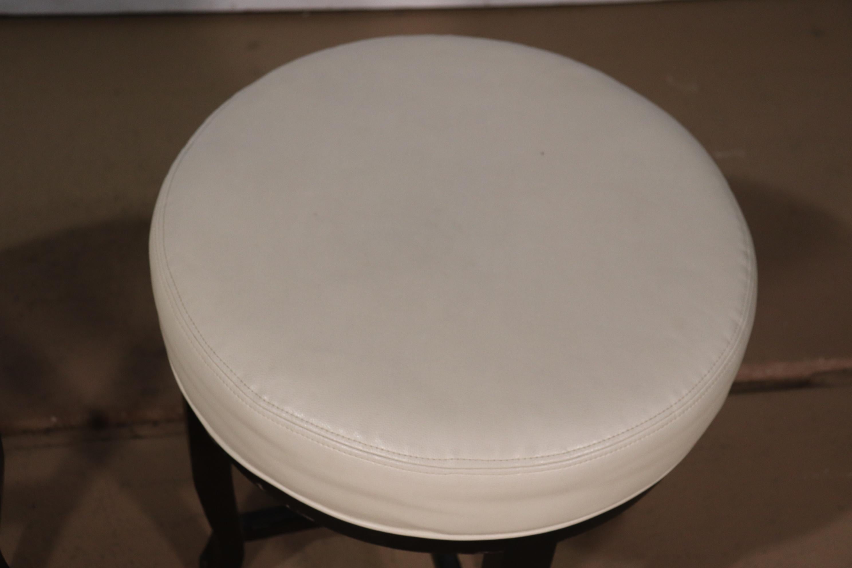Late 20th Century Pair Contemporary White Leather and Ebonized Round Stools