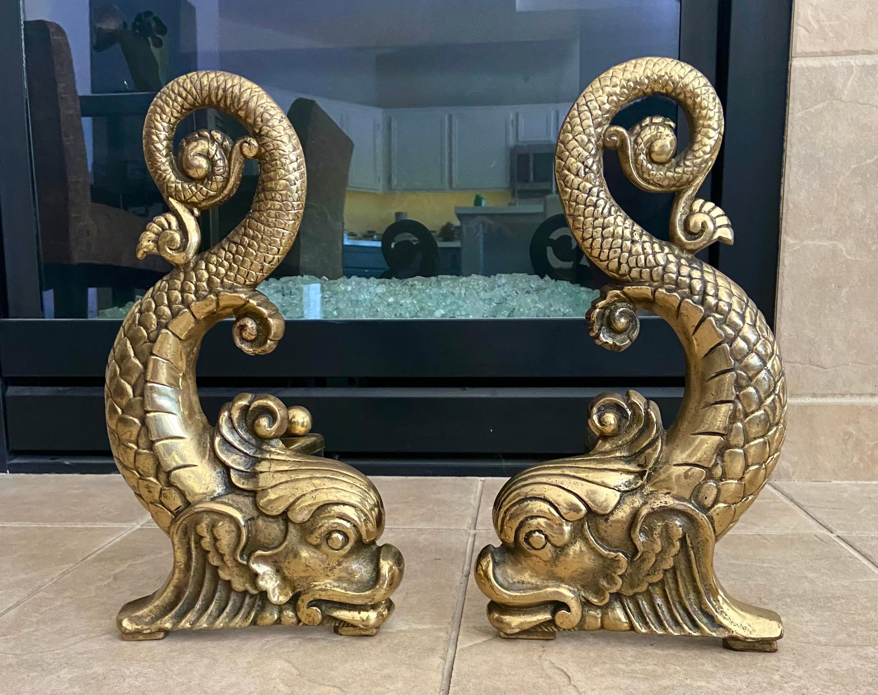 Pair solid brass Dolphin (fish) fireplace neoclassic style andirons or chenets with iron/brass legs. Expertly crafted with fine detailing throughout. European origin most likely France.
