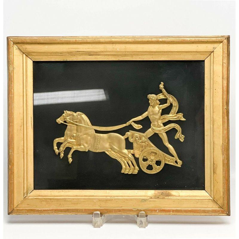 Pair Continental Gilt Bronze Roman Reliefs of Charioteers Framed c. 1900

Each with a gilt bronze classical charioteers holding torches and leading a pair of horses. Mounted in period gilt wood frames. Possibly originally mounted to furniture or
