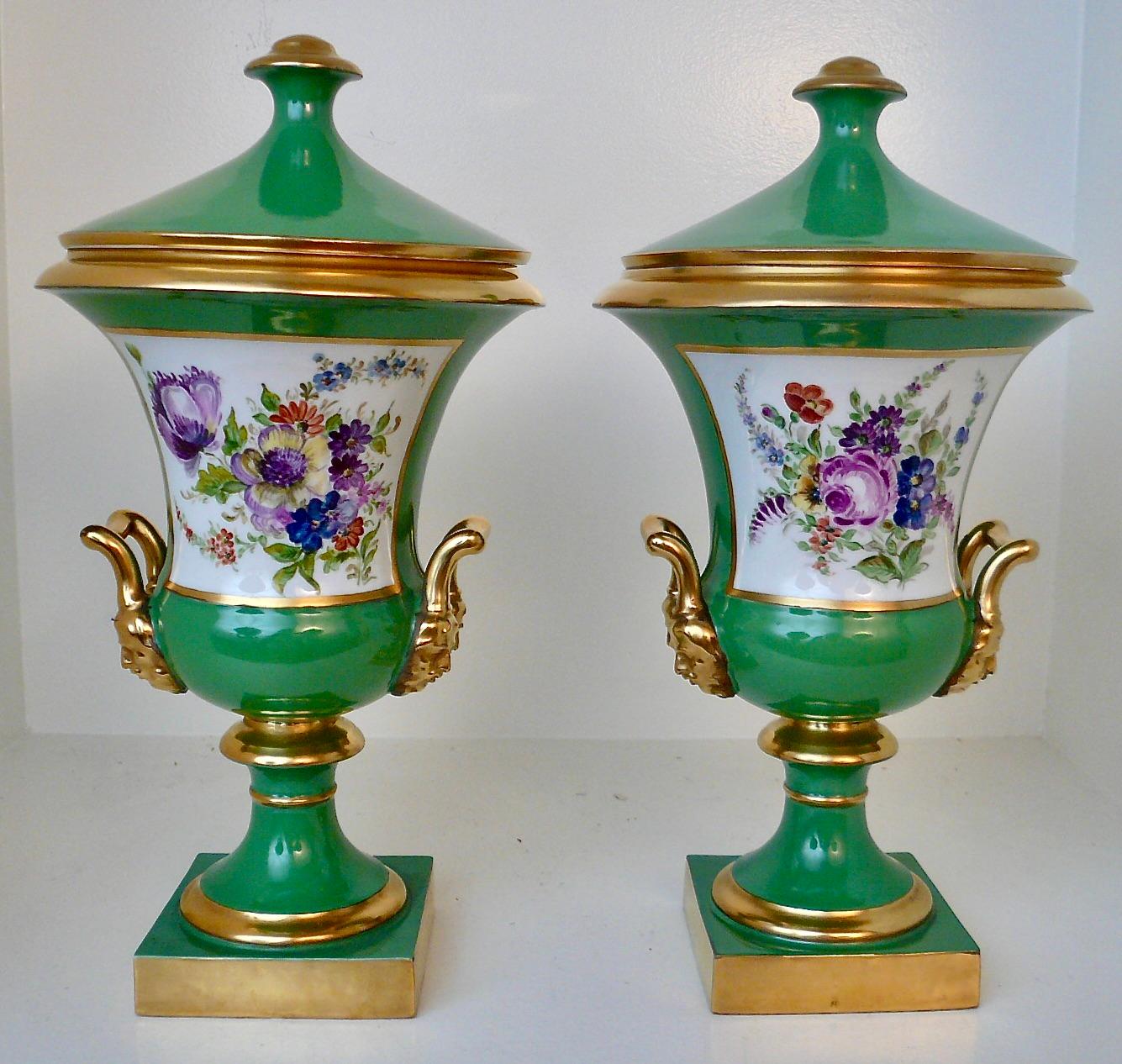 Hand-Painted Pair Continental Green Porcelain Campana urns with Hunting Scenes and Flowers For Sale