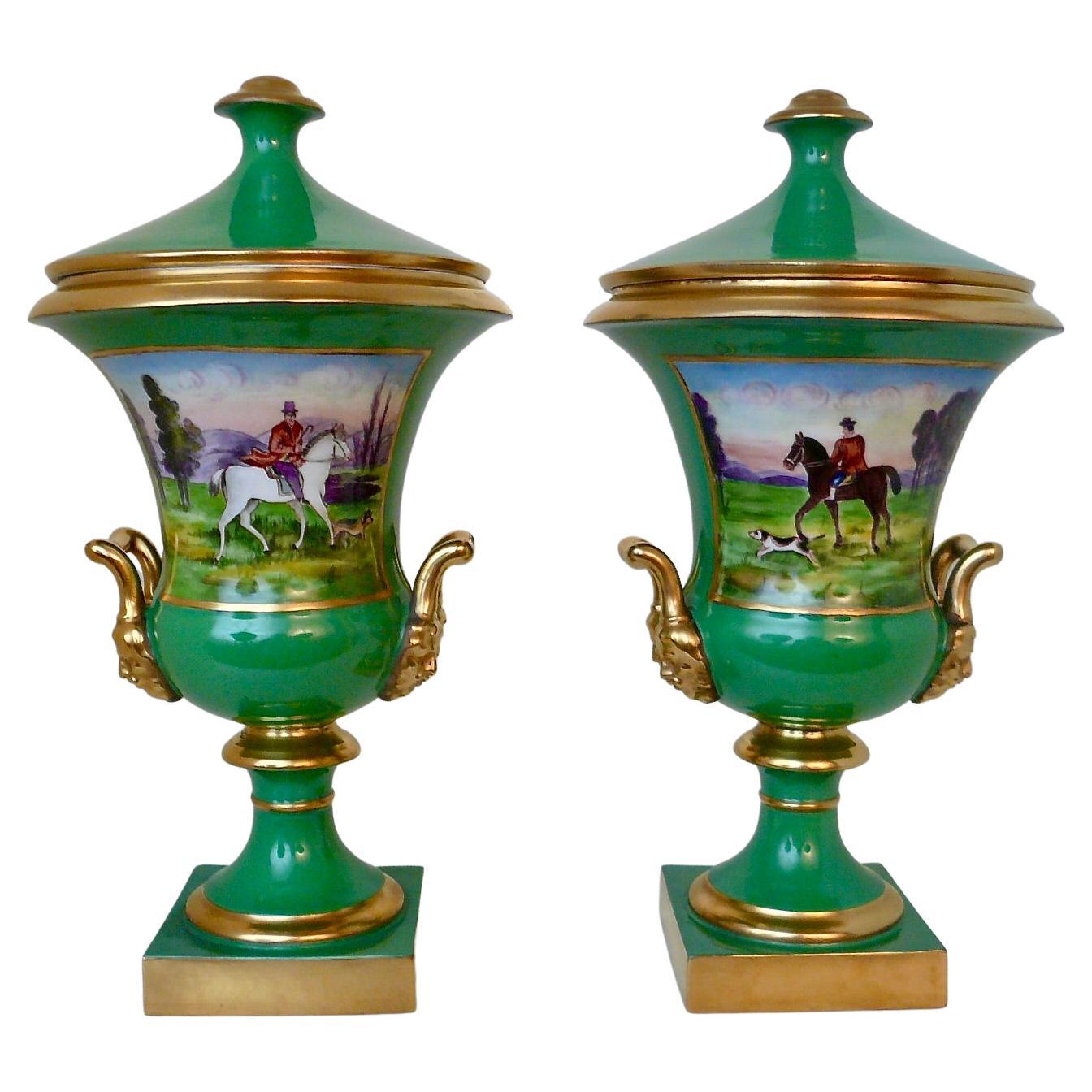Pair Continental Green Porcelain Campana urns with Hunting Scenes and Flowers For Sale