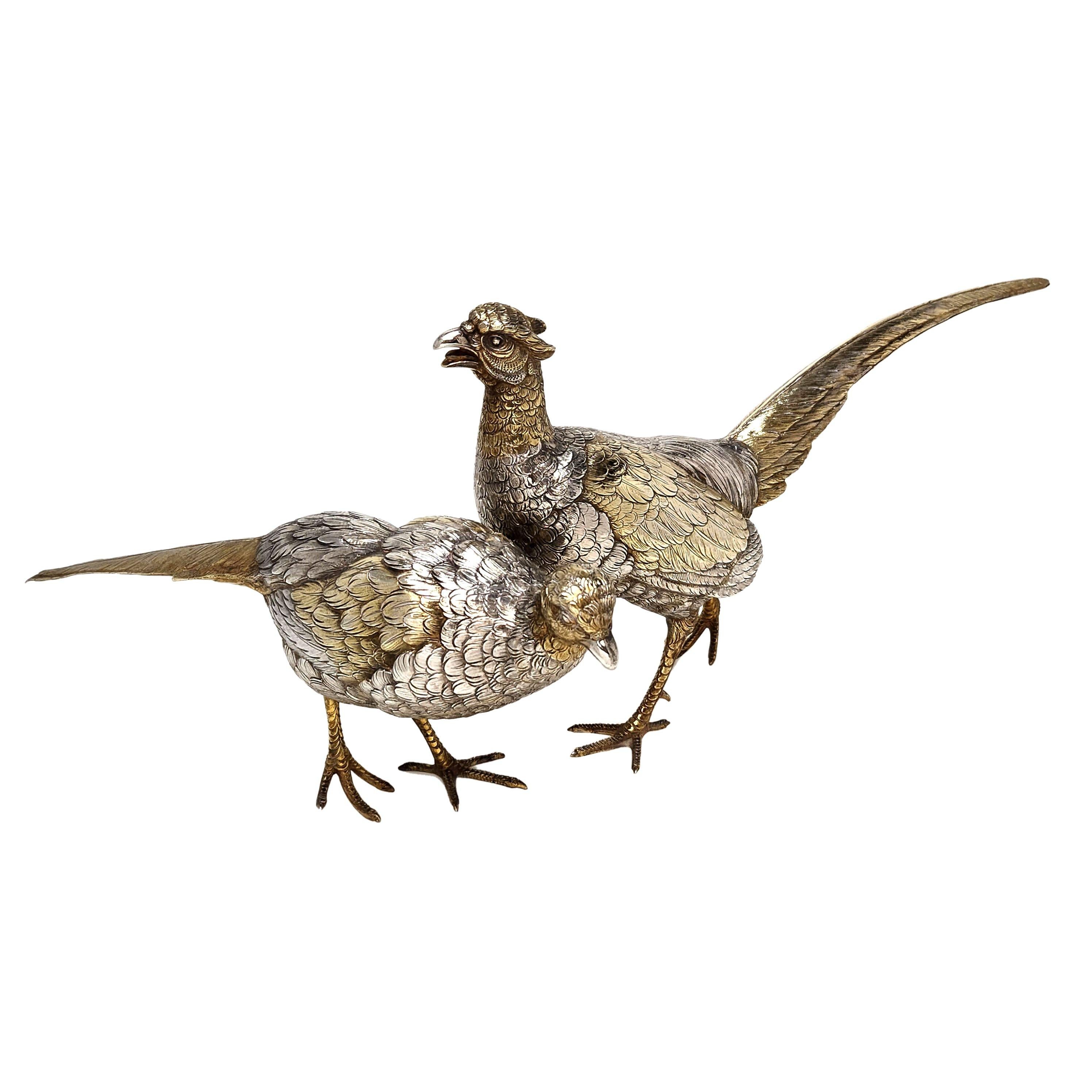 A pair of magnificent Antique sterling silver model Pheasants modelled with a great attention to detail. The Birds are each parcel gilt to add a level of visual interest.

Continental silver made in c. 1920.

Approx. Total Weight - 1392g /