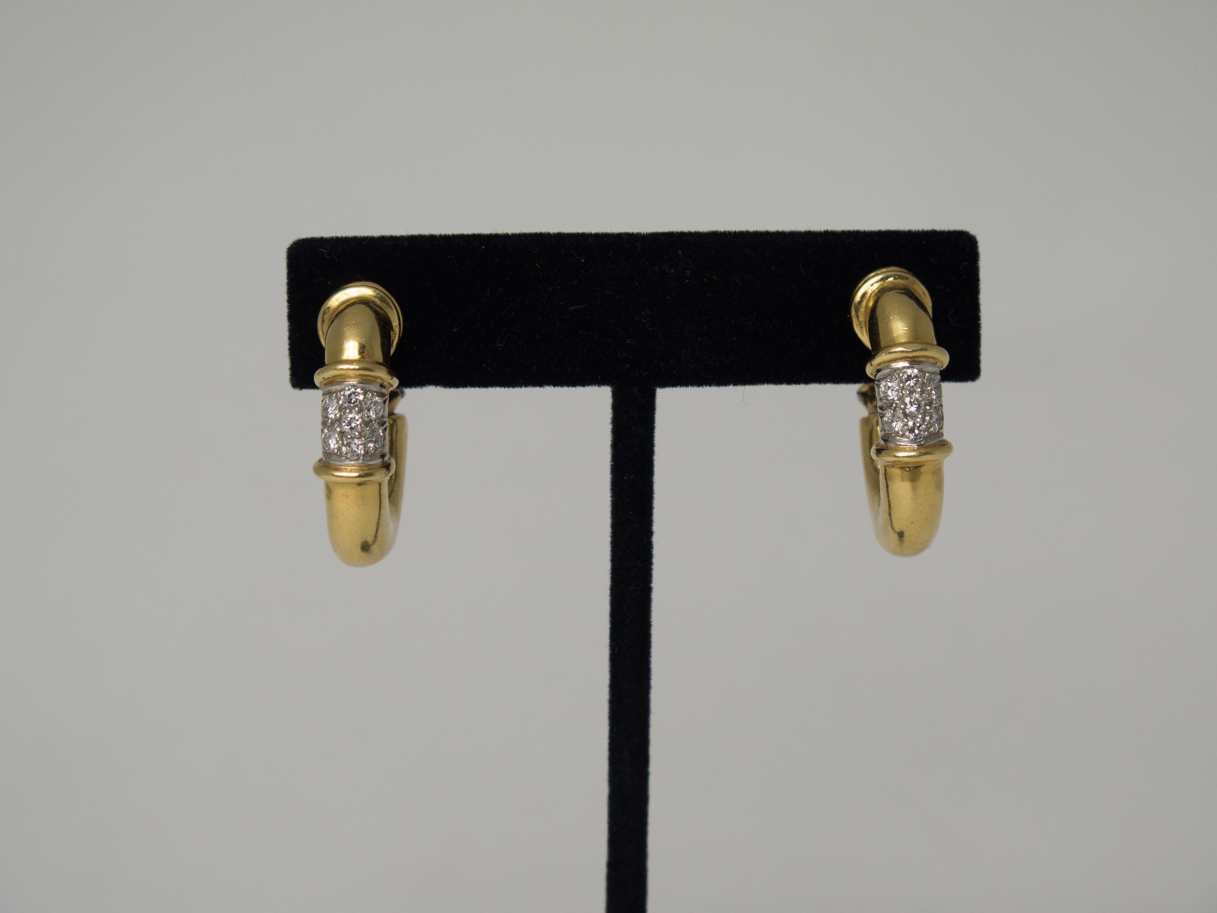 An elegant and versatile pair of convertible day and night door knocker style earrings. The large hanging hoops can be worn two ways, with the diamonds at the top, or at the bottom. Or, the hoops can be completely removed for a more understated look
