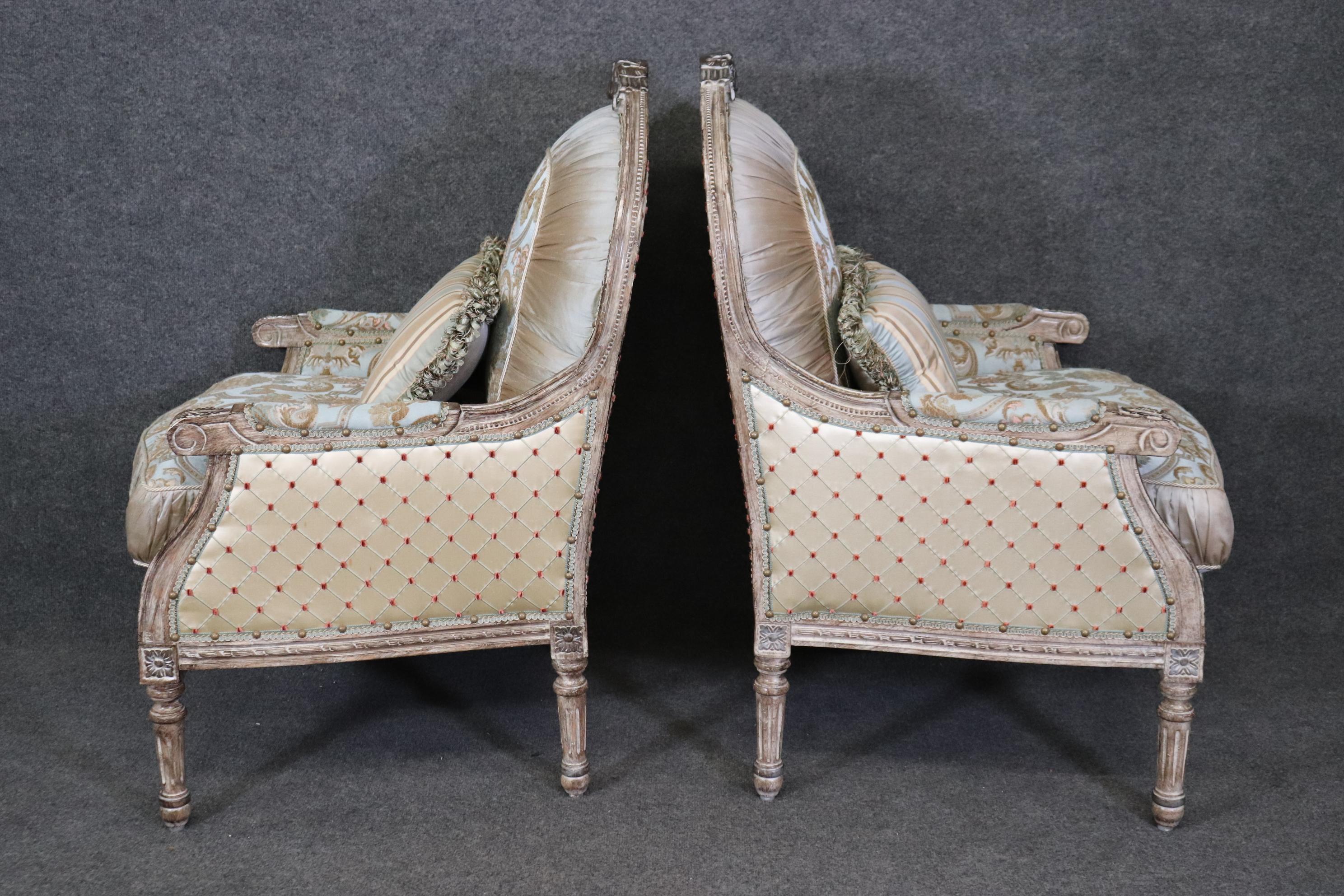 Mid-20th Century Pair Creme Paint Decorated Pleated Carved French Louis XVI Bergere Chairs 