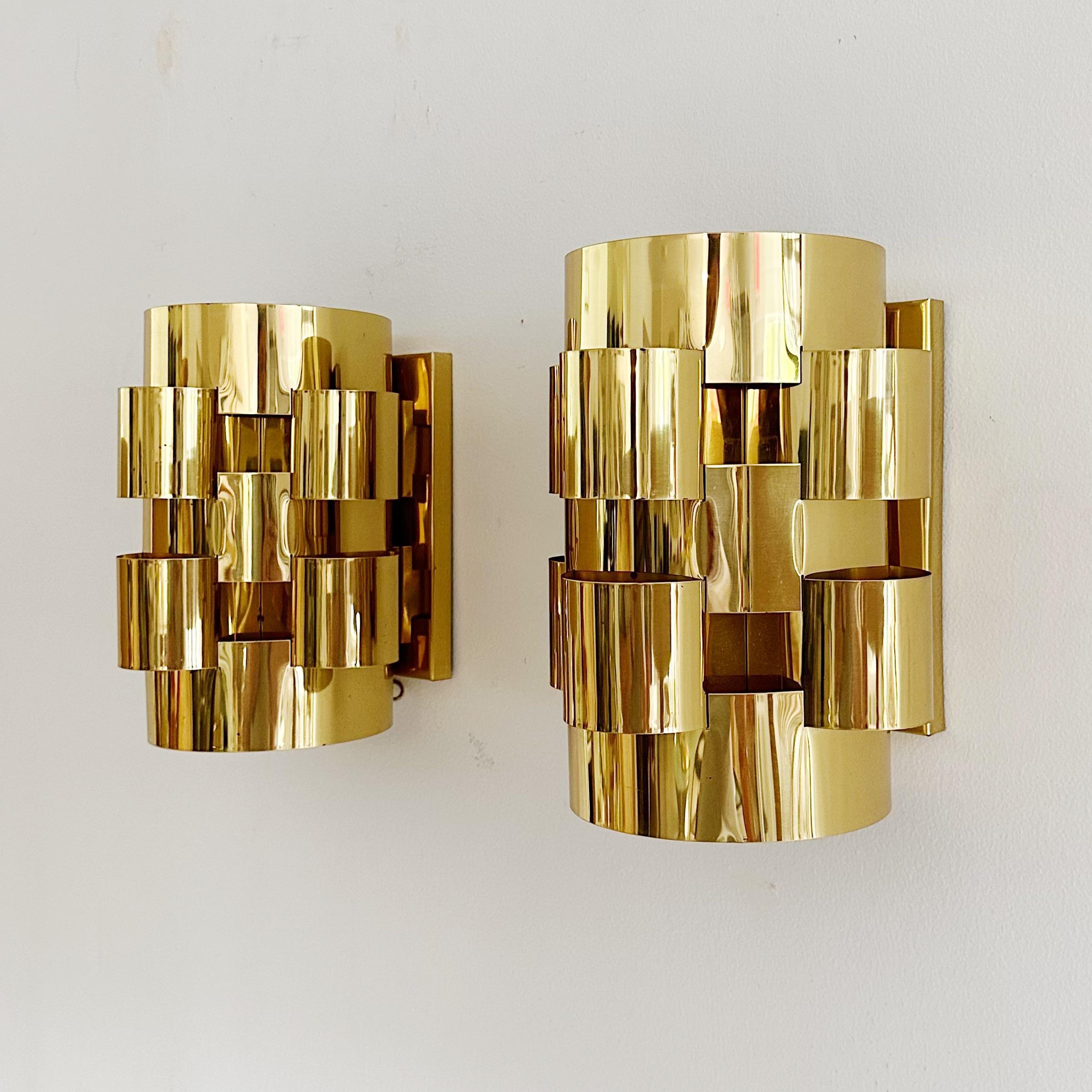 Curtis Jere sconces, brass clouds, signed. Pair of cloud form sconces in polished and lacquered brass. both of these sconces are signed 