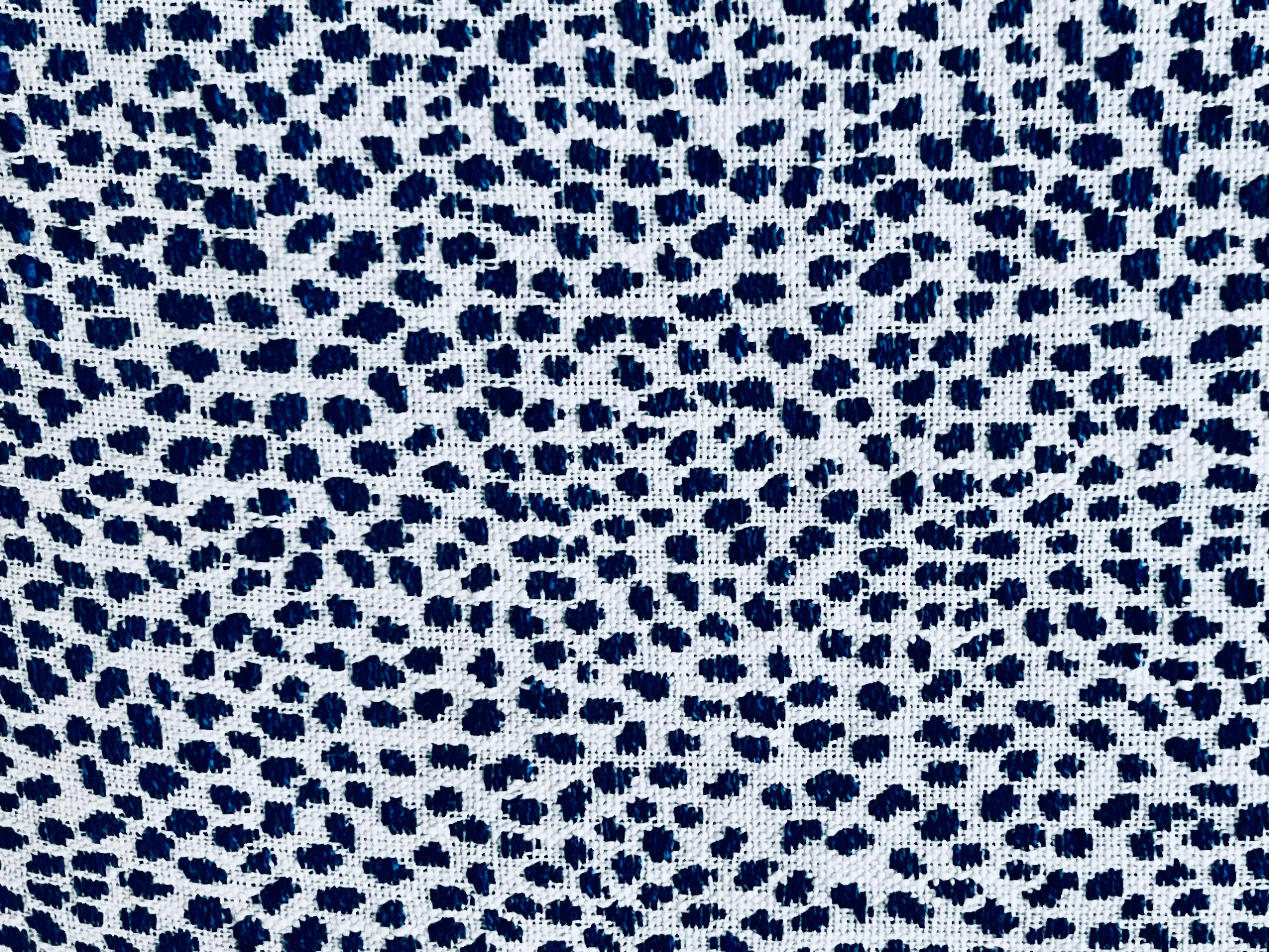 Pair of pillows/cushions in a mini blue animal print on a light ground.  The edges are boxed out with a blind zipper at the bottom side of each pillow.  The inserts are feather and down.
Each crafted by a delicate hand.
Square-19”
D-5-6”

The oblong