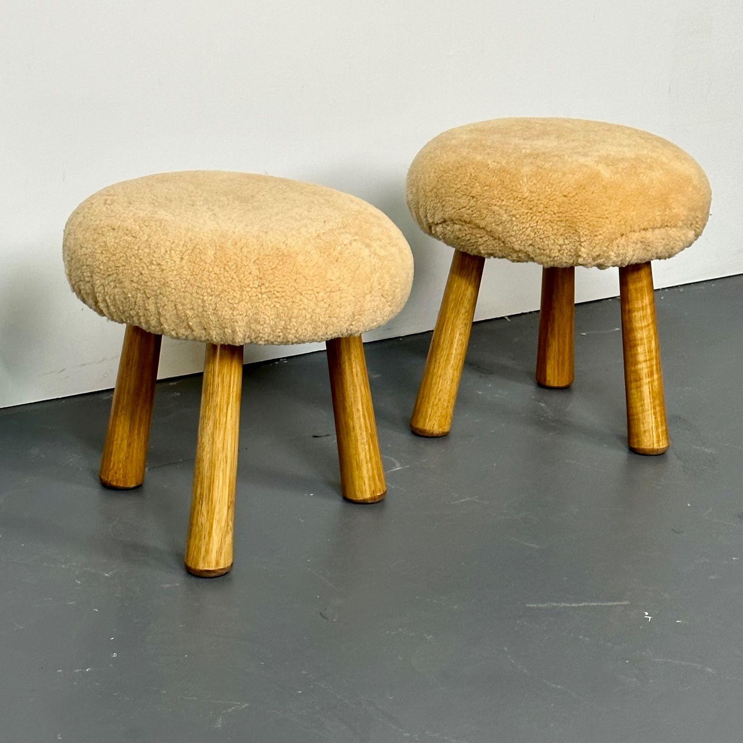 Pair of Contemporary Scandinavian Modern Style Sheepskin Stools / Ottomans
Contemporary organic form tri-pod stools or ottomans. New memory foam cushioning and genuine shearling. Can mix and match beige or honey sheepskin color stools. The beige