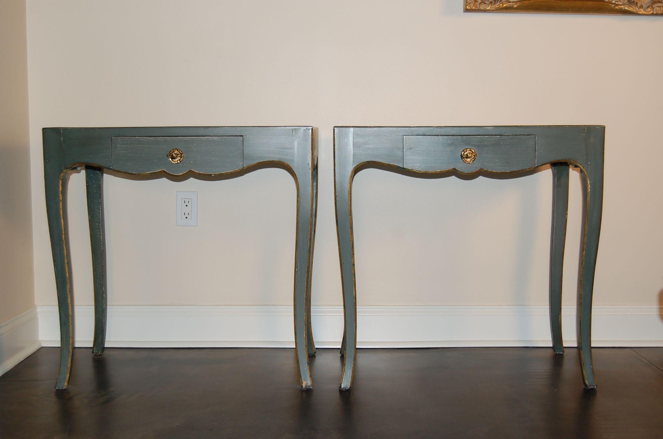A pair of green painted side tables with drawers custom made by The Guild Furniture Crafters Company in Pittsburgh, PA, circa 2000. Each table has one drawer and finely shaped and tapered legs. The finish was purposely distressed to give the tables