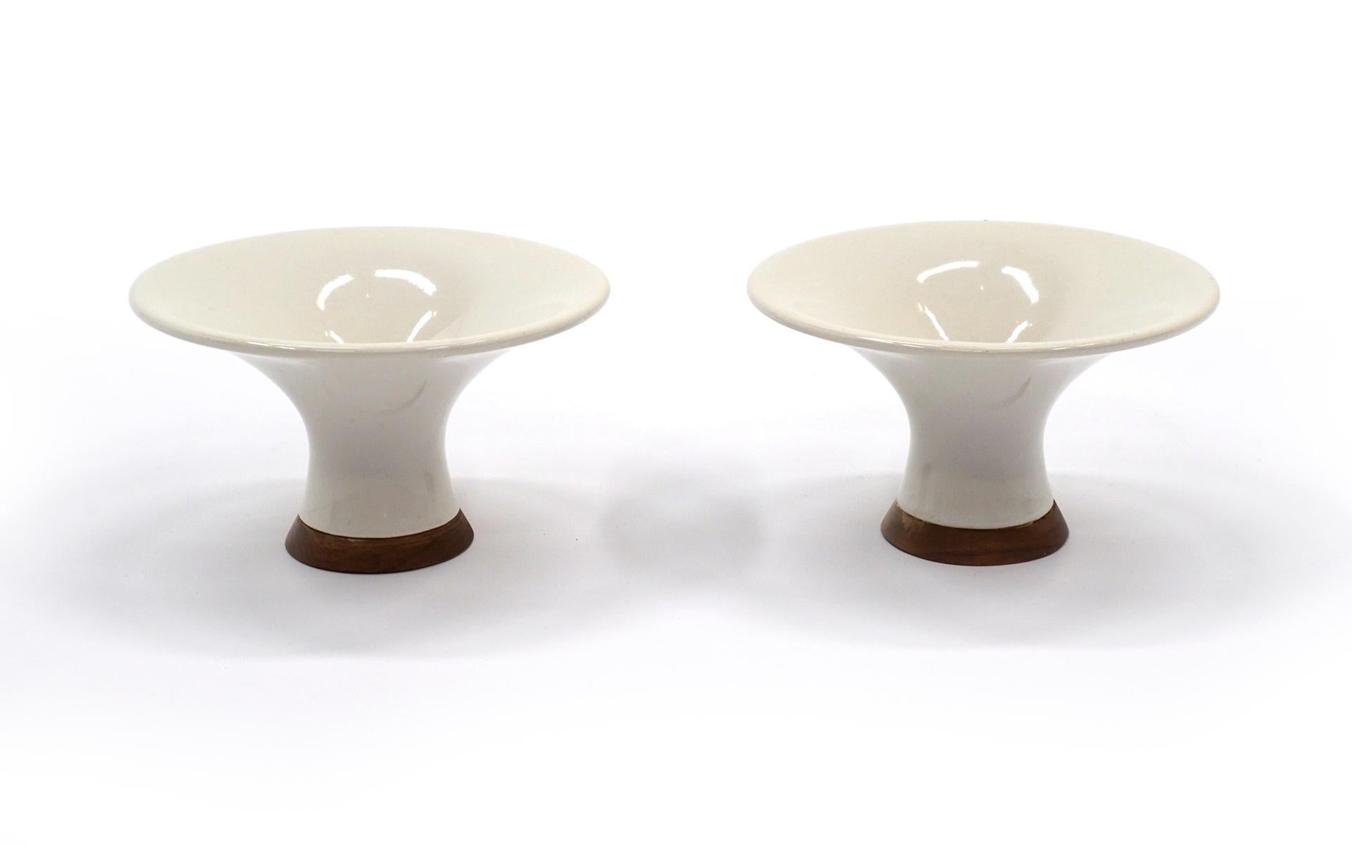 Pair of Danish candleholders / candlesticks. Fluted ivory ceramic with solid teak base. Beautifully understated pair. No chips, cracks, or repairs. Free and fast shipping to the Continental US via FedEx arriving to you within 3-6 days.