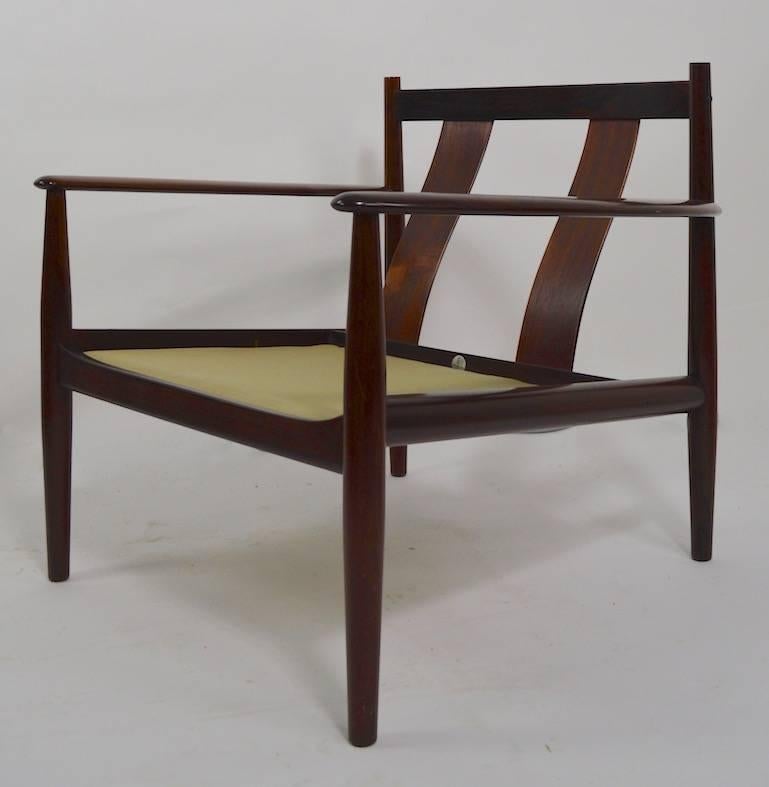 Rare pair of lounge chairs designed by Grete Jalk for France and Sons. Unusual to see this form in rosewood, excellent original and clean condition. Arm Height 20.5 inches. x Seat height 17 inches.